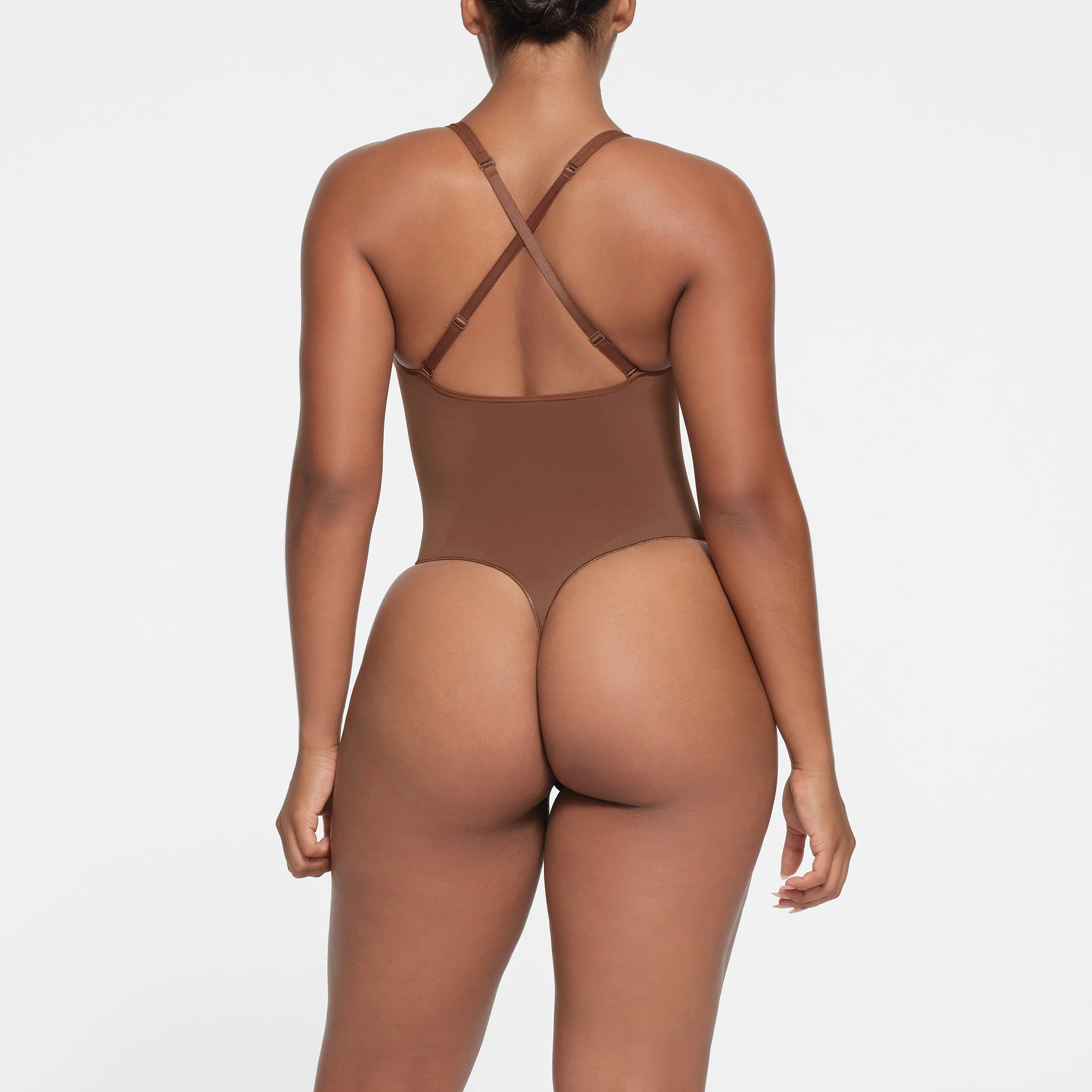 SEAMLESS SCULPT DEEP PLUNGE THONG BODYSUIT | JASPER ON A MODEL BACK VIEW