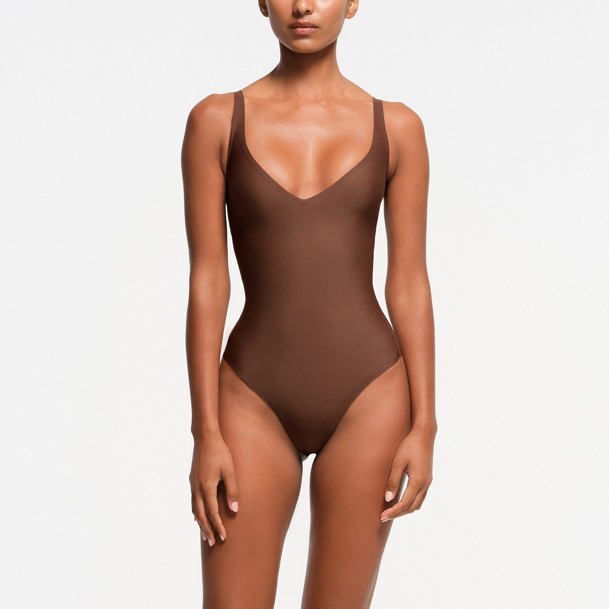 SKIMS BODY ZONED PLUNGE BODYSUIT | JASPER ON A MODEL FRONT VIEW