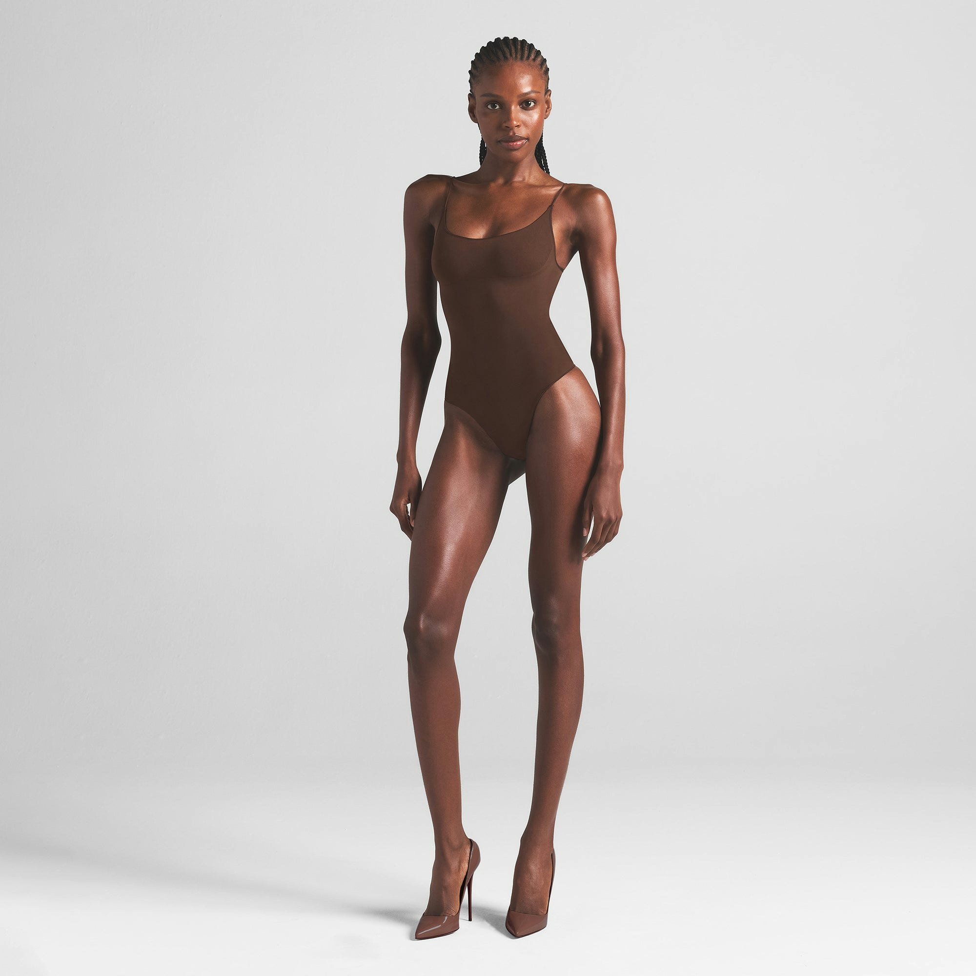SHEER SEAMLESS THONG BODYSUIT | COCOA ON A MODEL FRONT VIEW | FOCUS: 0.0, 1.0, 0.9