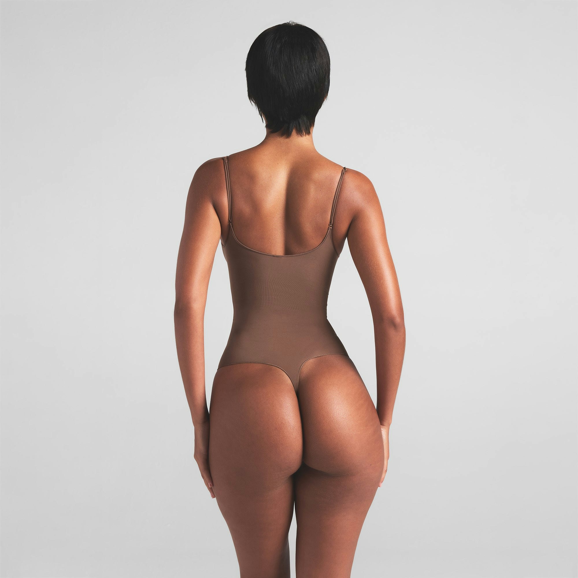 SHEER SEAMLESS THONG BODYSUIT | JASPER ON A MODEL BACK VIEW | FOCUS: 0.0, 1.0, 0.9