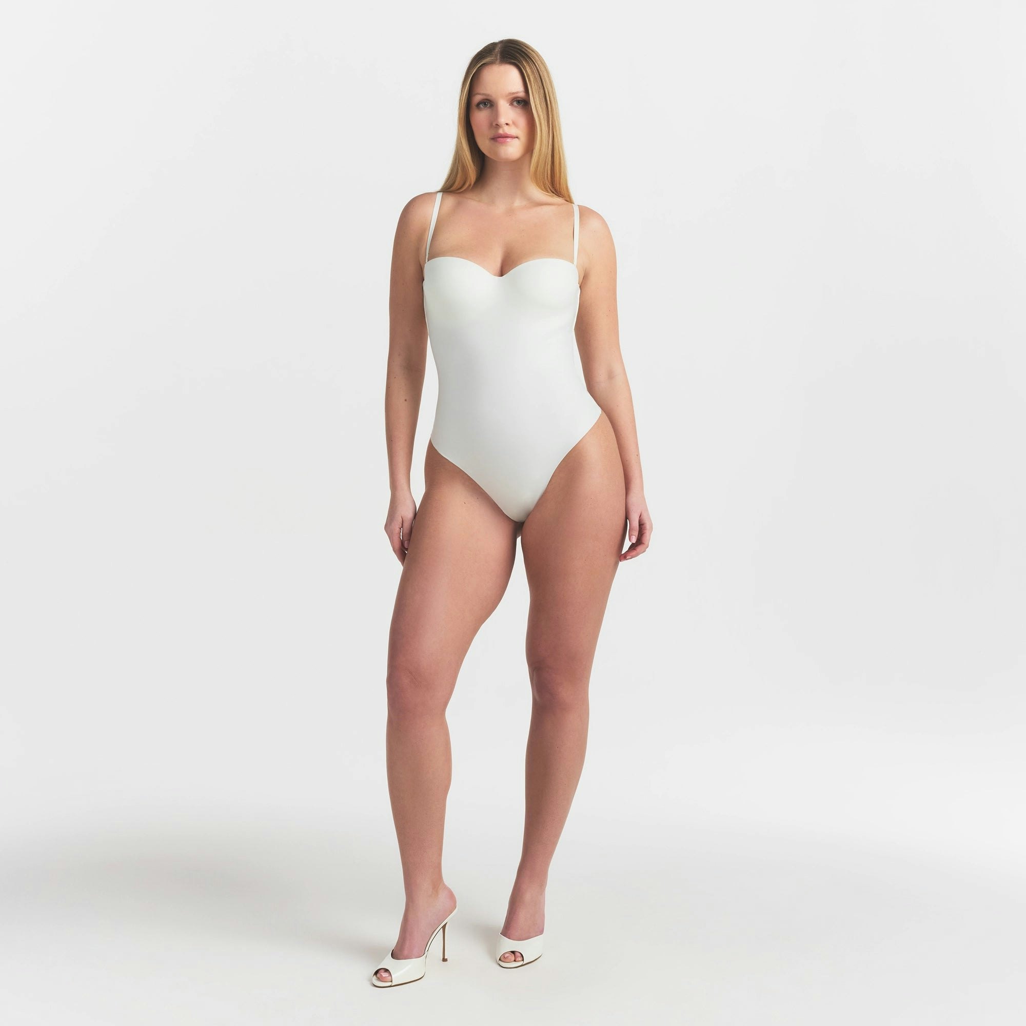 SKIMS BODY UNDERWIRE THONG BODYSUIT | IVORY ON A MODEL FRONT VIEW @ | FOCUS: 0.0, 1.0, 0.9