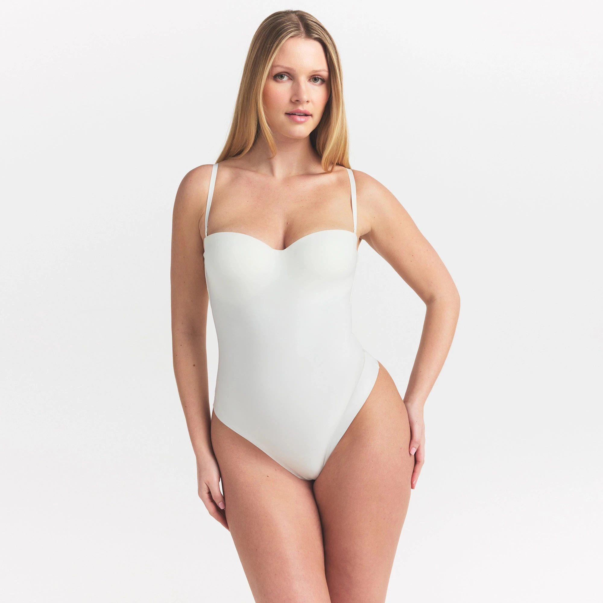 SKIMS BODY UNDERWIRE THONG BODYSUIT | IVORY ON A MODEL SIDE VIEW @ | FOCUS: 0.0, 1.0, 0.9
