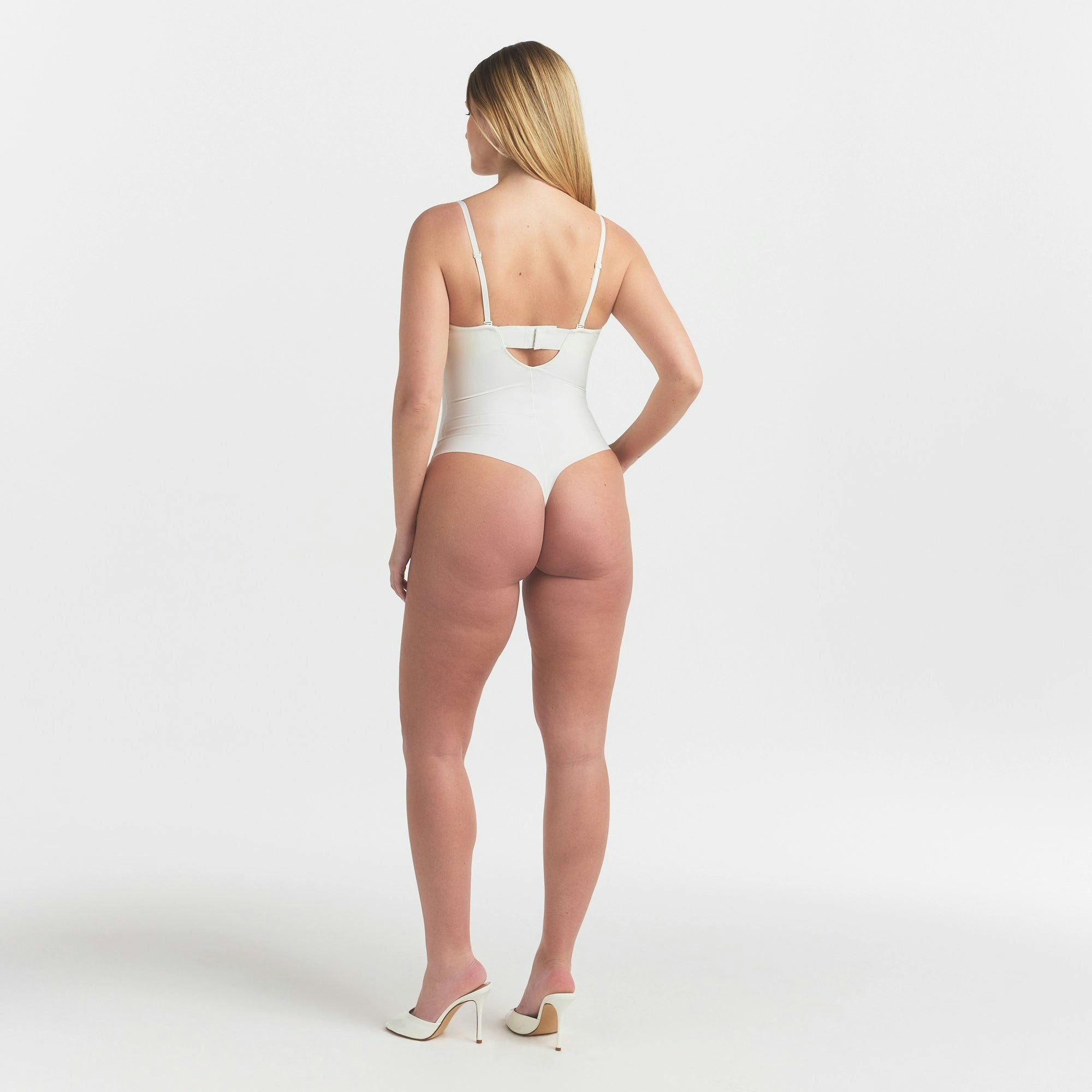 SKIMS BODY UNDERWIRE THONG BODYSUIT | IVORY ON A MODEL FRONT VIEW @ | FOCUS: 0.0, 1.0, 0.9