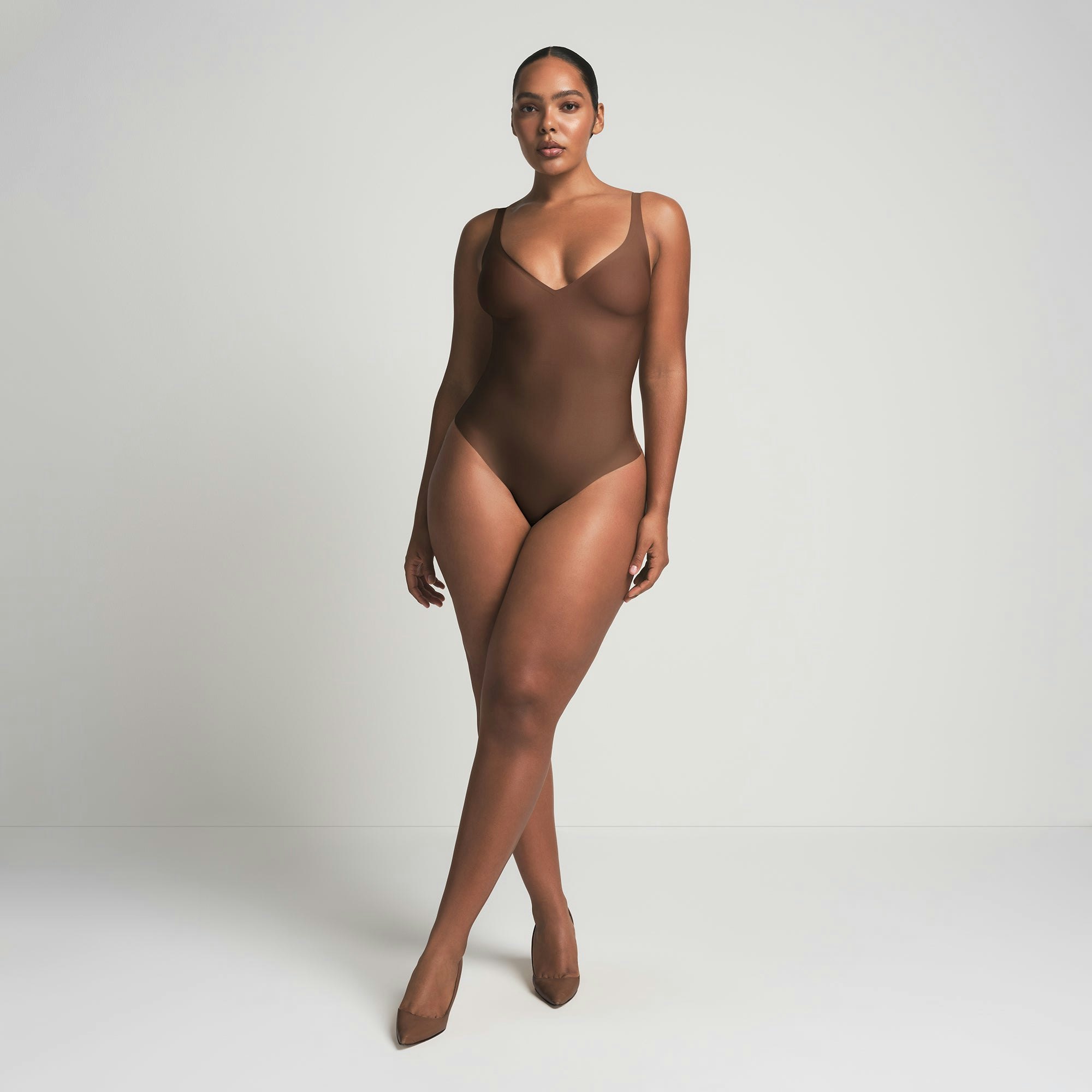 SKIMS BODY UNLINED PLUNGE THONG BODYSUIT | JASPER ON A MODEL FRONT VIEW @ | FOCUS: 0.0, 1.0, 0.9