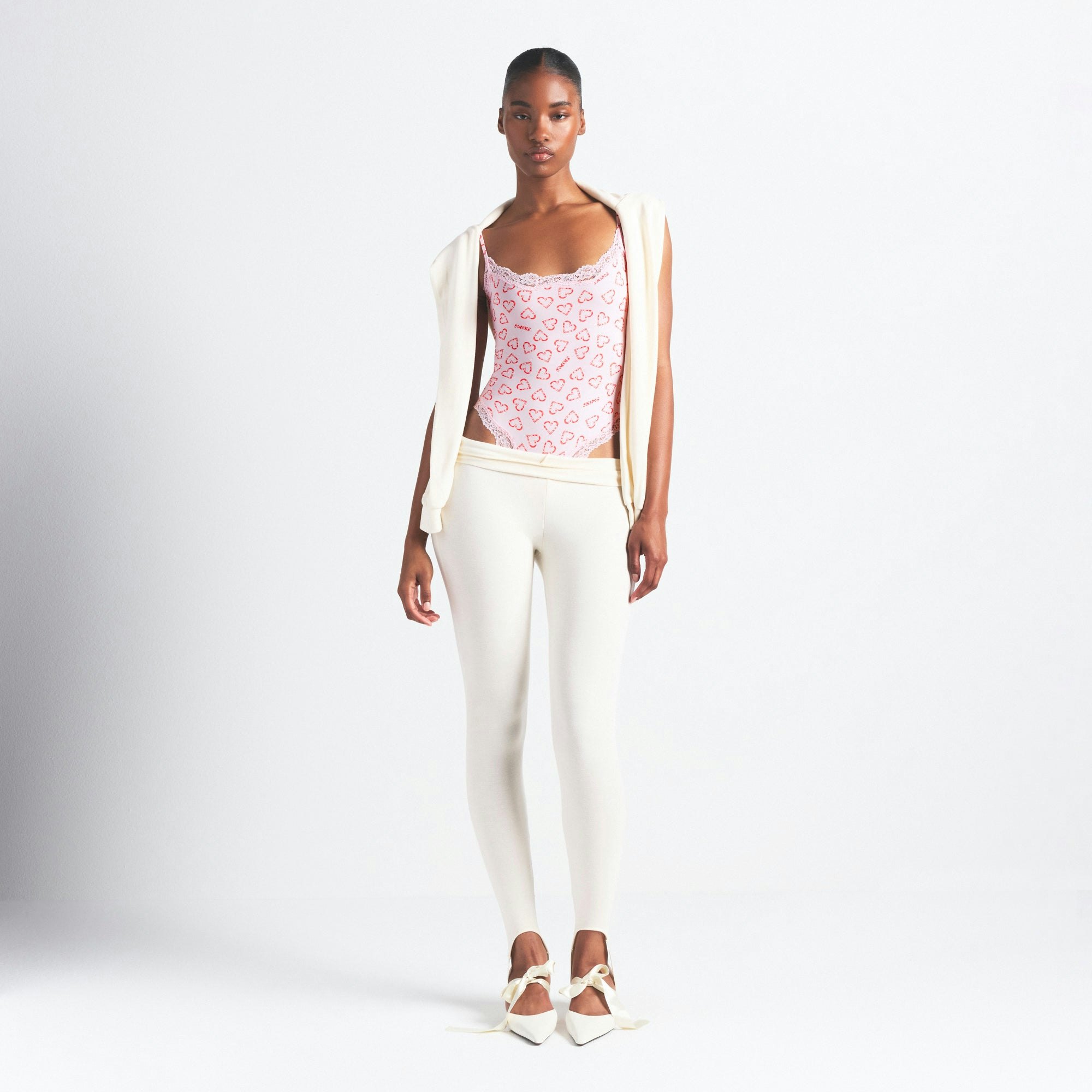 FITS EVERYBODY LACE CAMI BODYSUIT | CHERRY BLOSSOM CANDY HEART PRINT ON A MODEL FRONT VIEW @ | FOCUS: 0.0, 1.0, 0.9