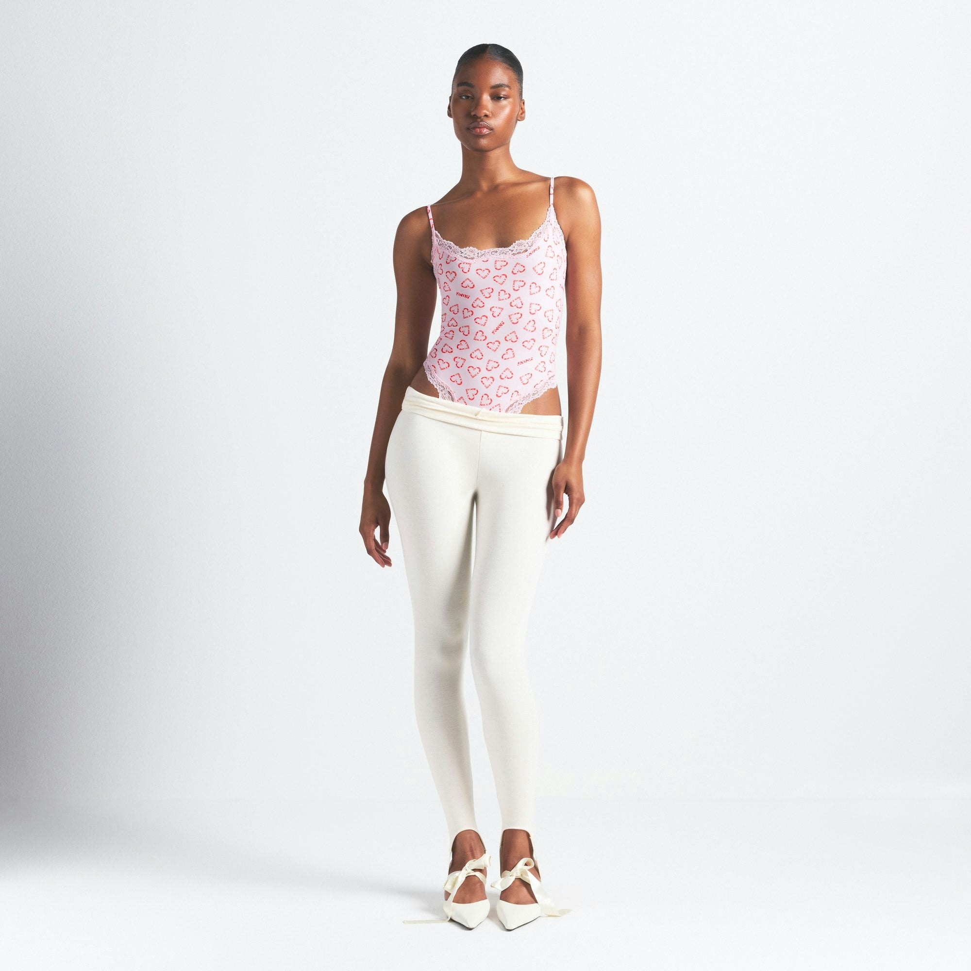 FITS EVERYBODY LACE CAMI BODYSUIT | CHERRY BLOSSOM CANDY HEART PRINT ON A MODEL FRONT VIEW @ | FOCUS: 0.0, 1.0, 0.9