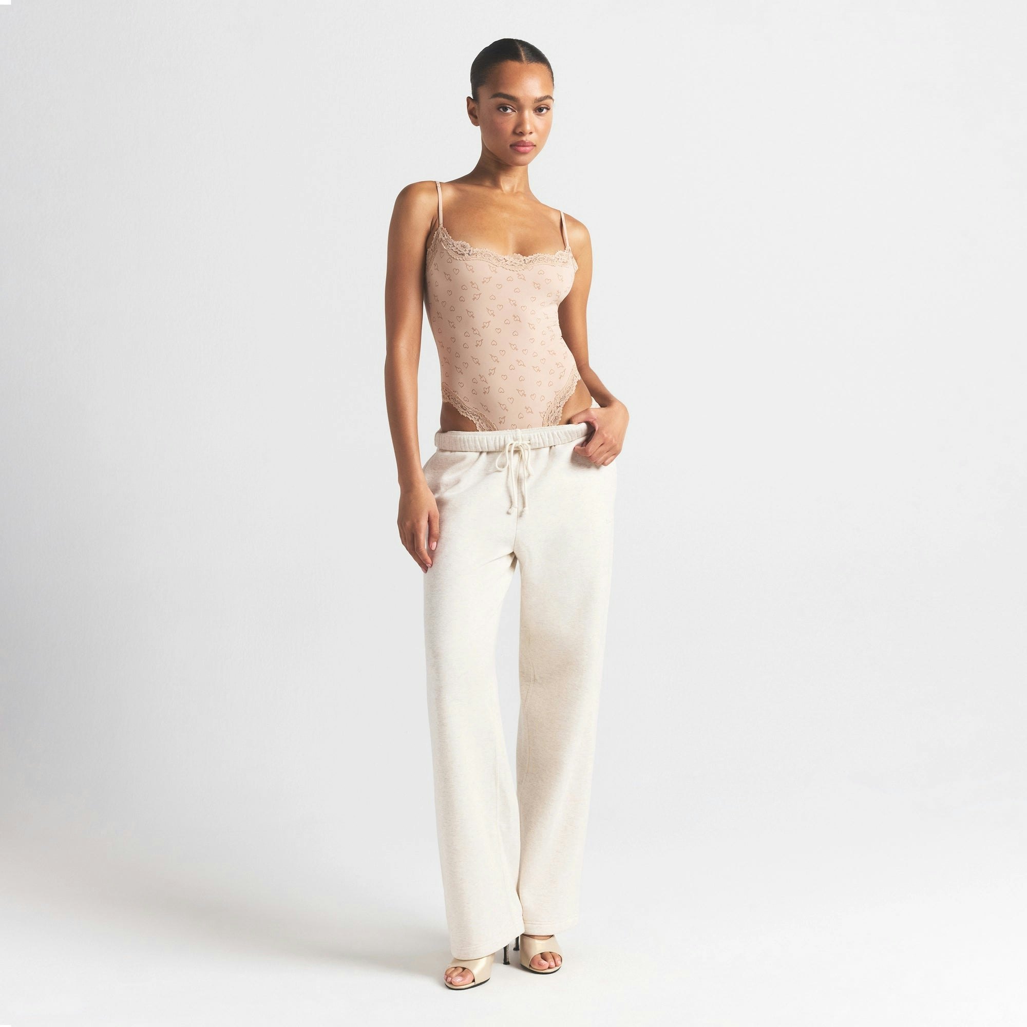 FITS EVERYBODY LACE CAMI BODYSUIT | MICA SKETCHED HEARTS ON A MODEL FRONT VIEW @ | FOCUS: 0.0, 1.0, 0.9