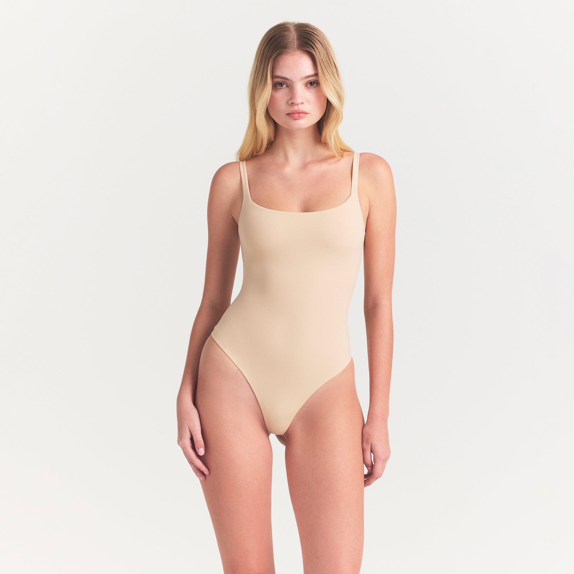 FITS EVERYBODY SQUARE NECK BODYSUIT | SAND ON A MODEL FRONT VIEW @ | FOCUS: 0.0, 1.0, 0.9