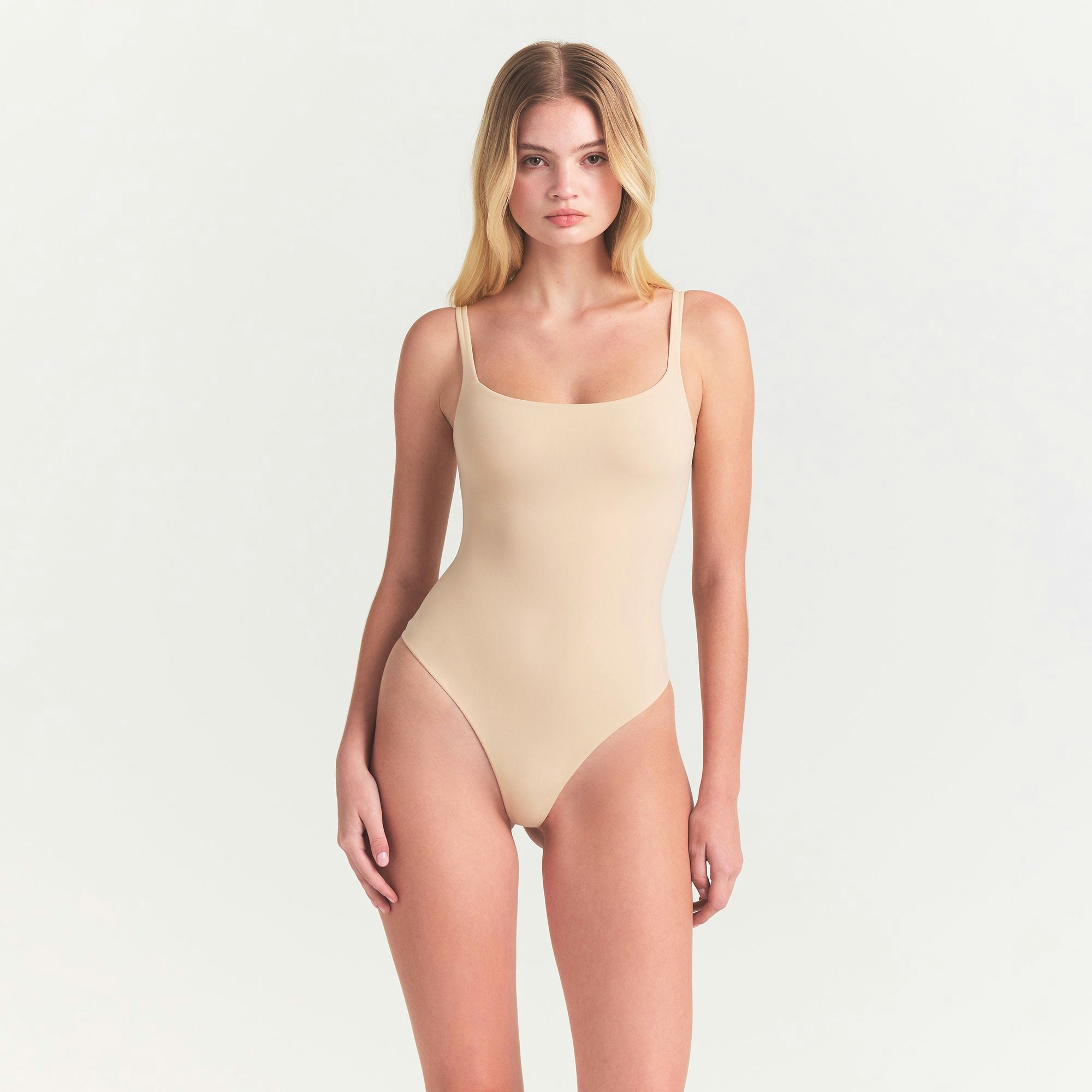 FITS EVERYBODY SQUARE NECK BODYSUIT | SAND ON A MODEL FRONT VIEW @ | FOCUS: 0.0, 1.0, 0.9