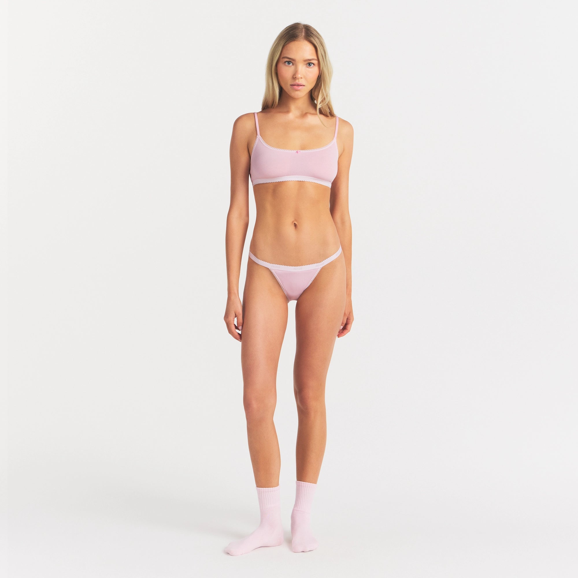 LIGHTWEIGHT COTTON LOGO PICOT STRING BIKINI | PEONY ON A MODEL FRONT VIEW