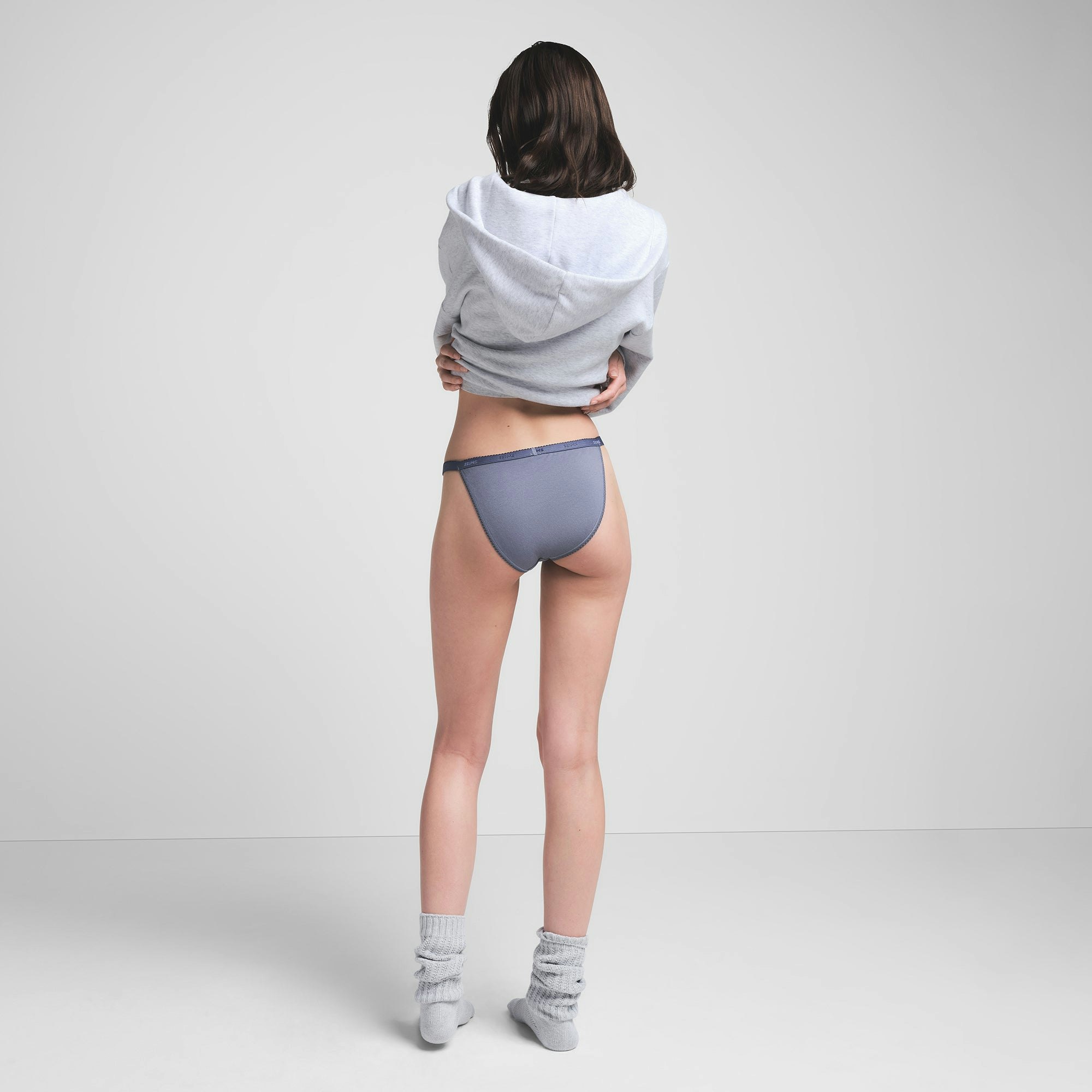 LIGHTWEIGHT COTTON PICOT LOGO STRING BIKINI | STEEL BLUE ON A MODEL BACK VIEW | FOCUS: 0.0, 1.0, 0.9