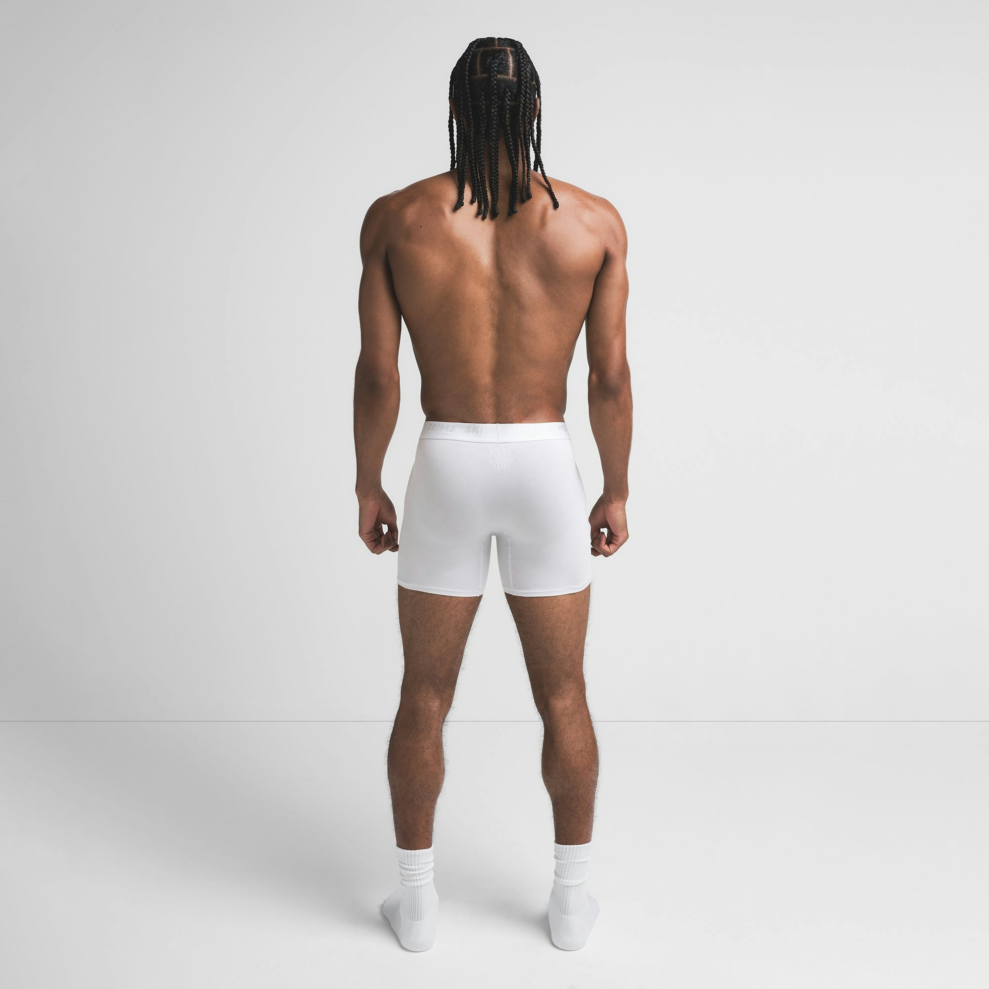 SKIMS STRETCH MENS 5" BOXER BRIEF | CHALK ON A MODEL BACK VIEW @ | FOCUS: 0.9, 0.1, 0.7