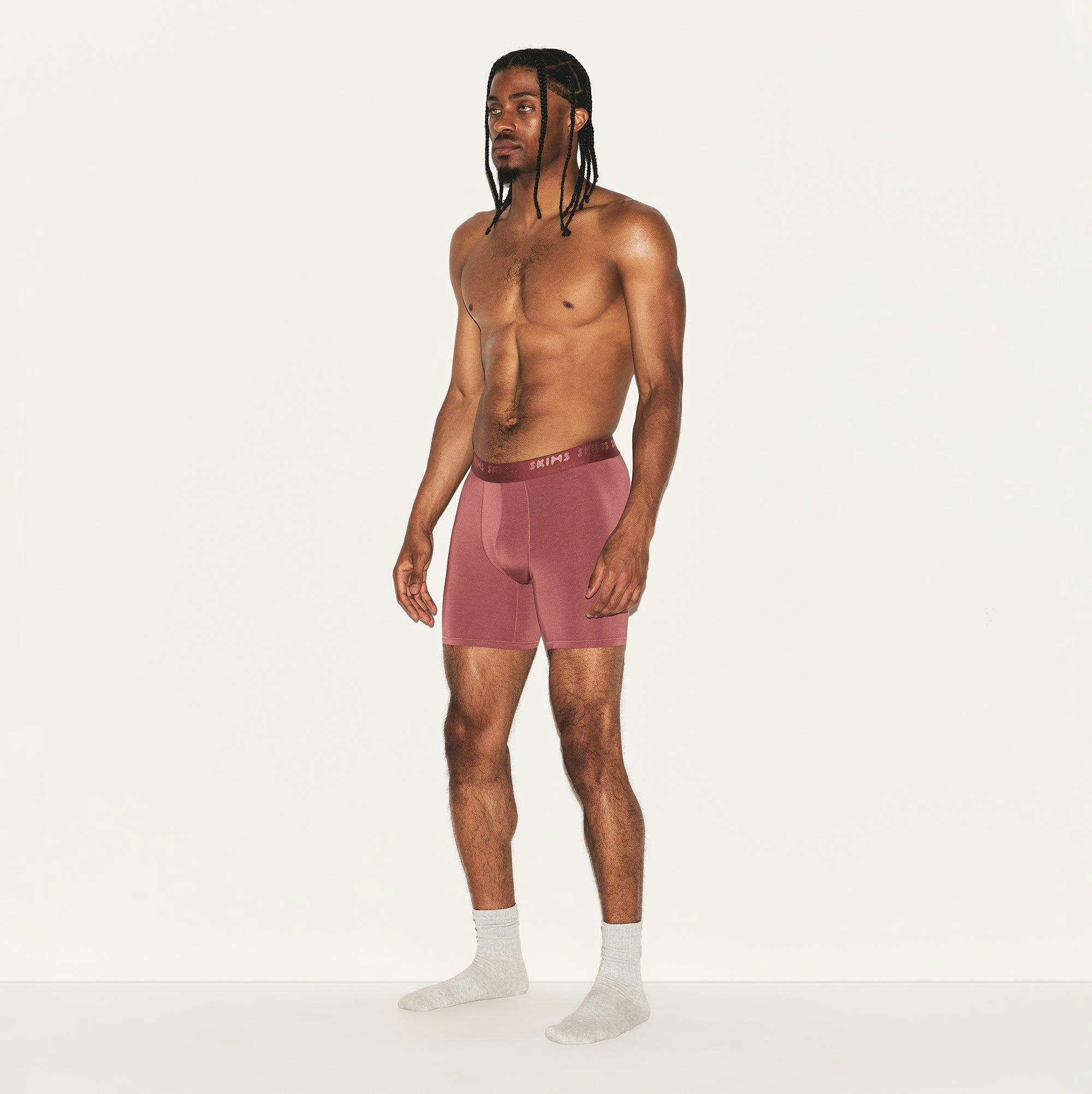 SKIMS STRETCH MENS 5 INCH BOXER BRIEF | CORDOVAN ON A MODEL SIDE VIEW | FOCUS: 0.0, 1.0, 0.9