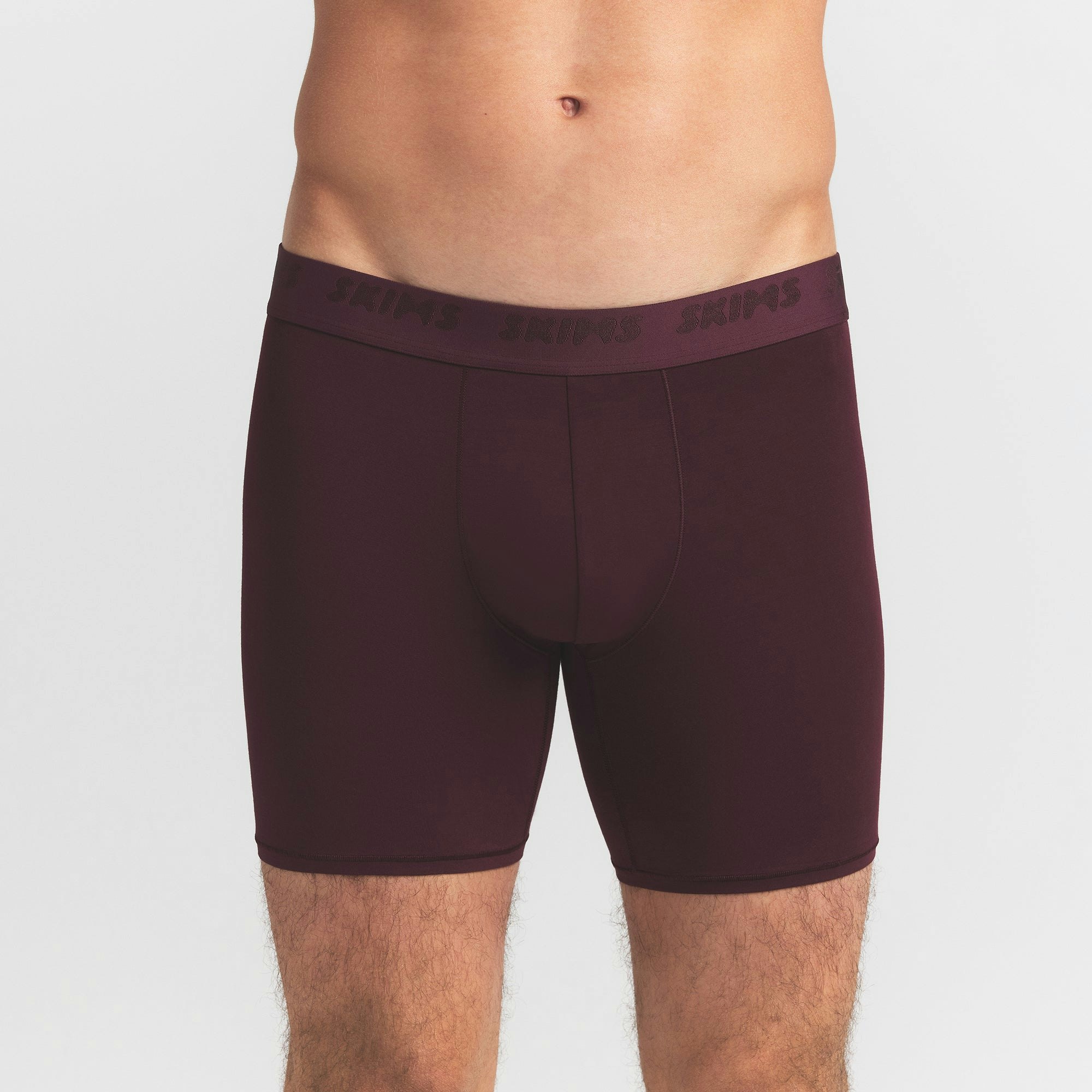 SKIMS STRETCH MENS 5" BOXER BRIEF | CURRANT ON A MODEL FRONT VIEW @ | FOCUS: 0.0, 1.0, 0.9