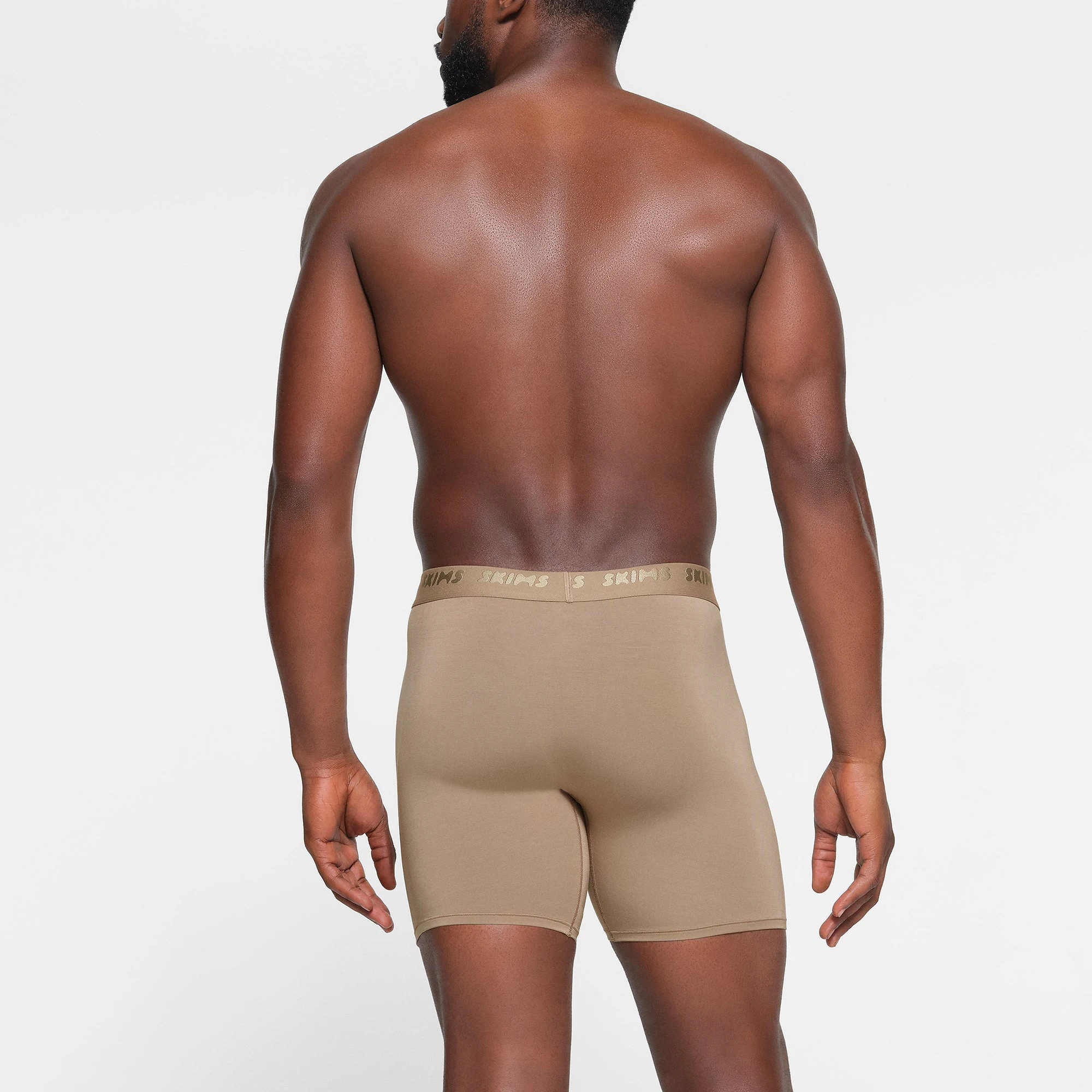 SKIMS STRETCH MENS 5" BOXER BRIEF 3-PACK WORN BY A MODEL IN BACK VIEW