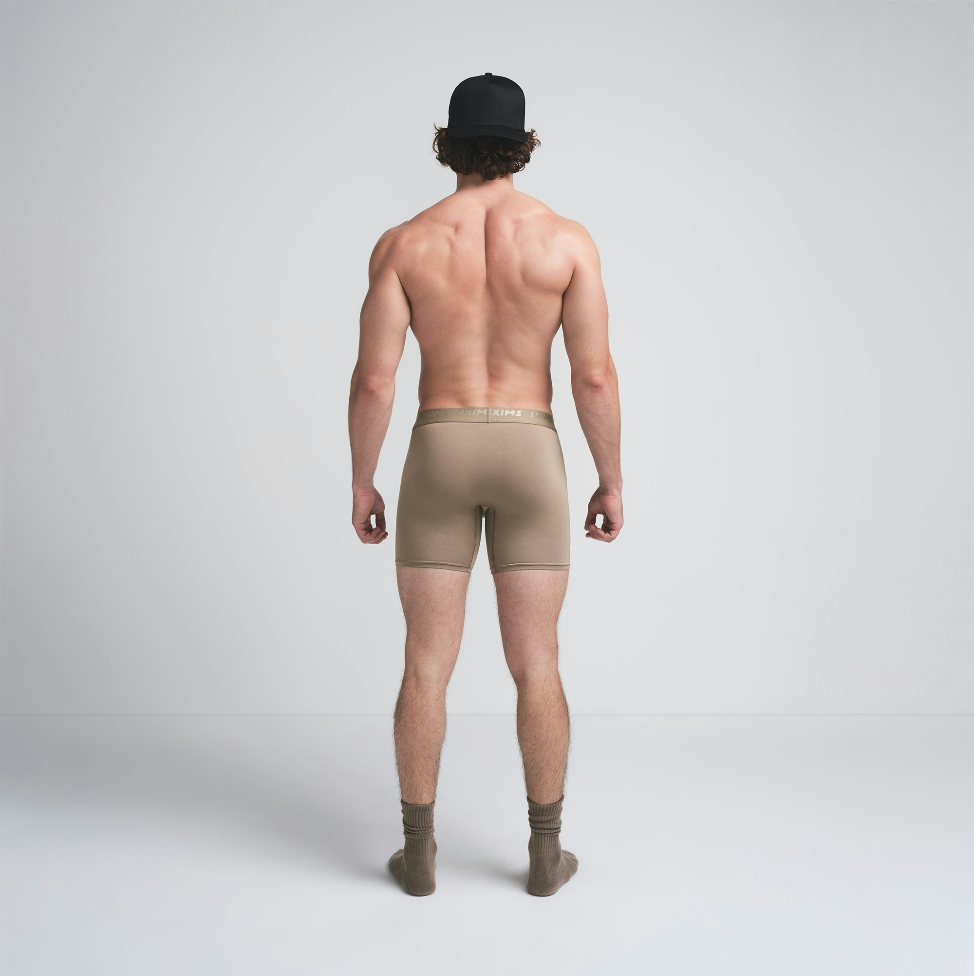 SKIMS STRETCH MENS 5" BOXER BRIEF | DESERT ON A MODEL BACK VIEW