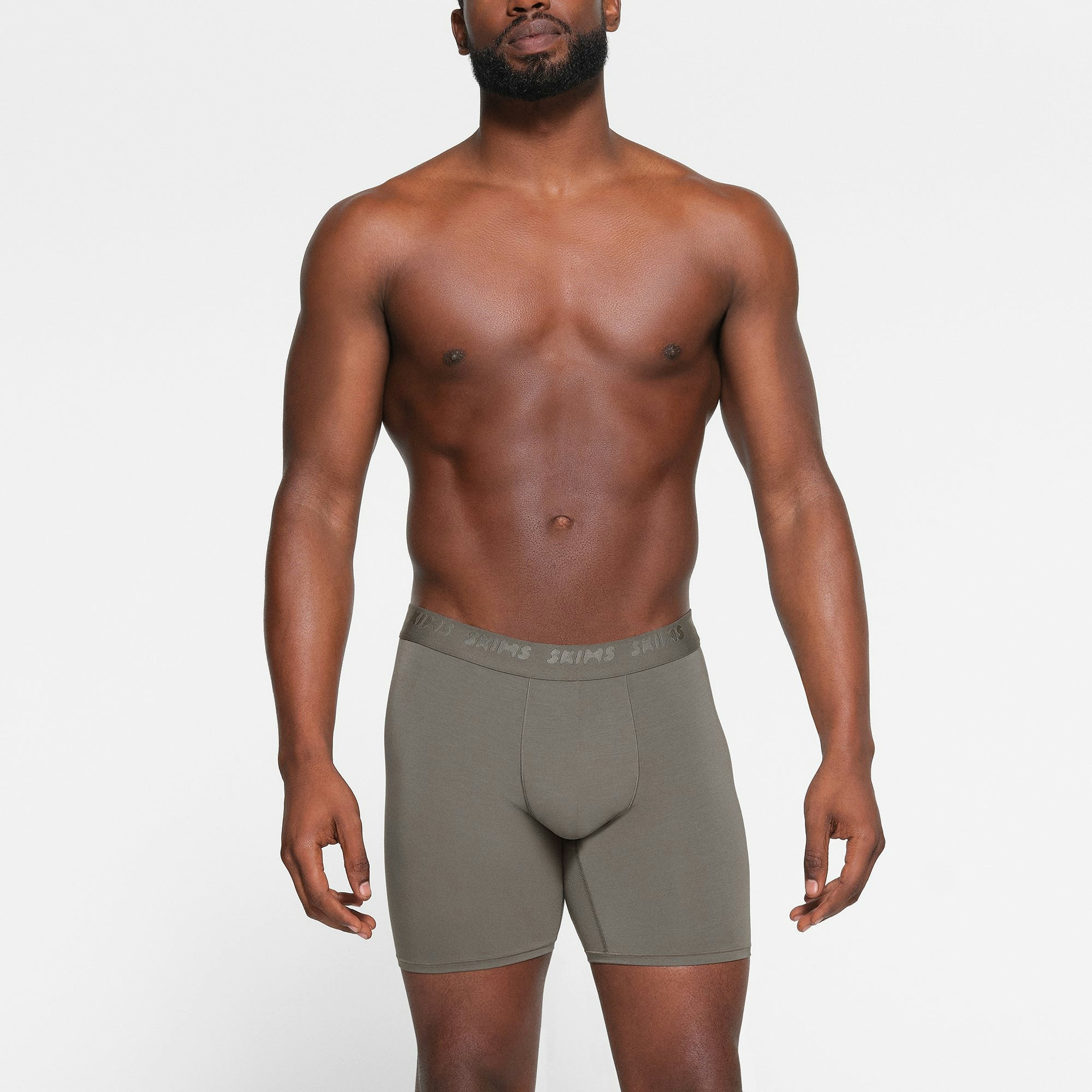 SKIMS STRETCH MENS 5" BOXER BRIEF 3-PACK WORN BY A MODEL IN FRONT VIEW