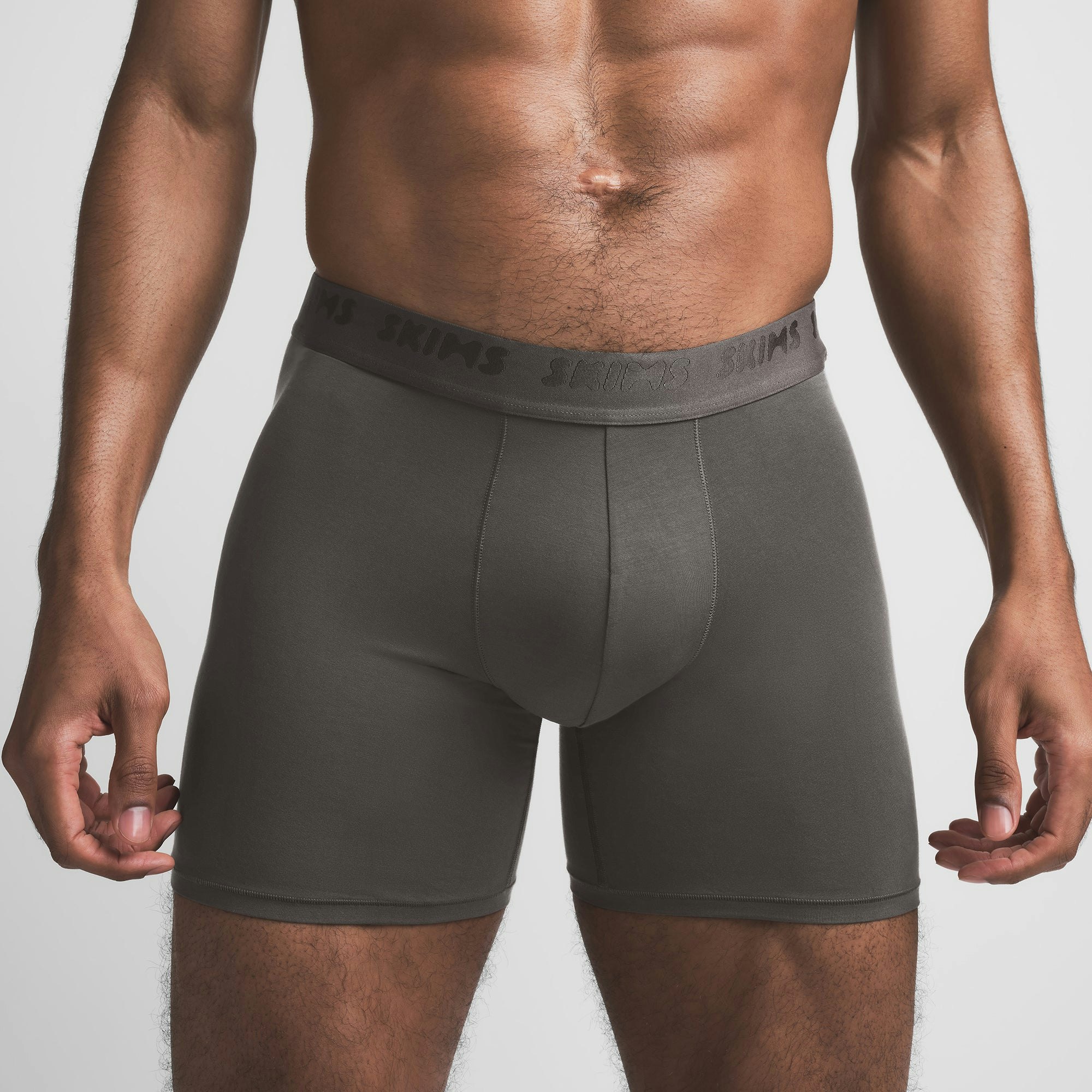 SKIMS STRETCH MENS 5" BOXER BRIEF | GUNMETAL ON A MODEL FRONT VIEW @ | FOCUS: 0.9, 0.1, 0.7