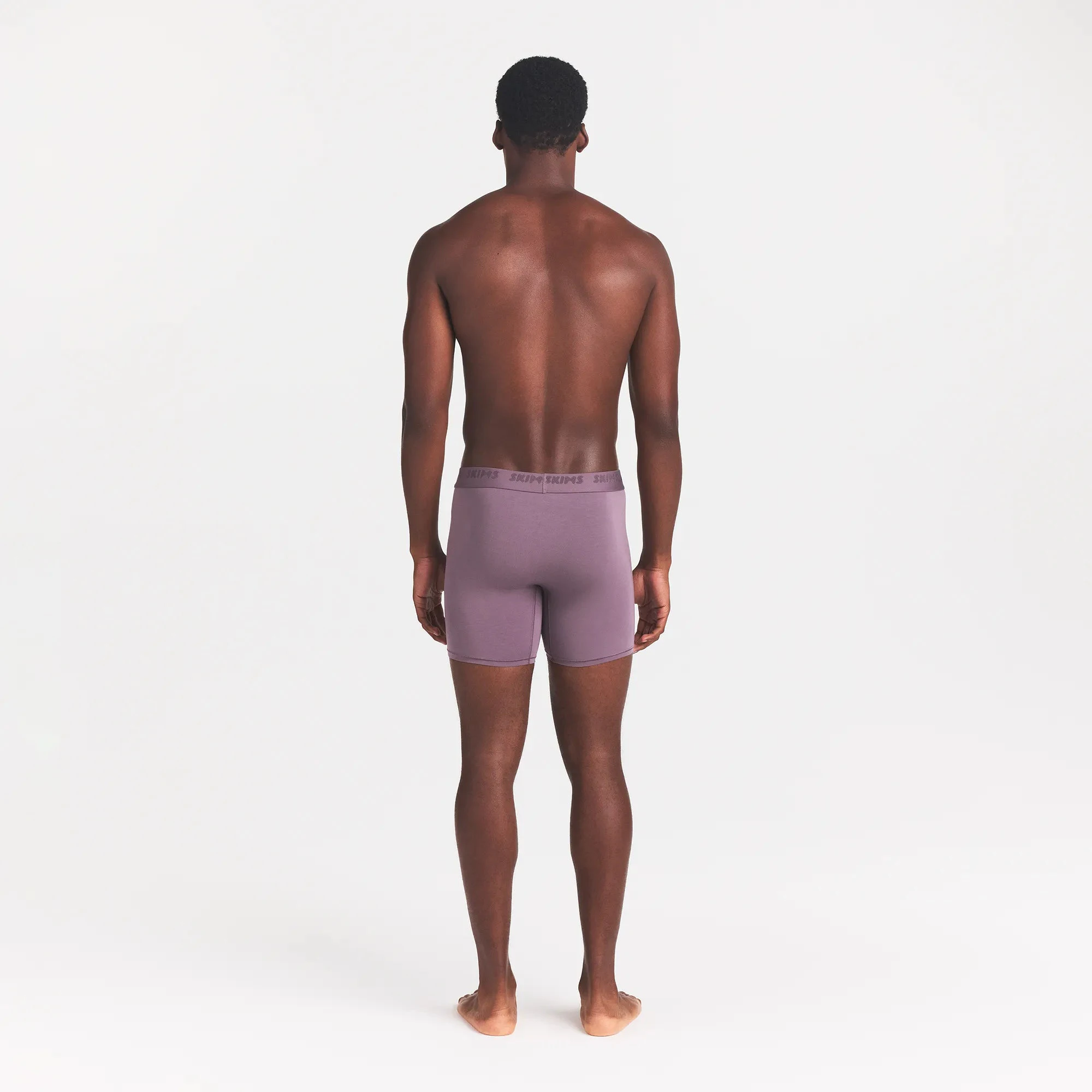 SKIMS STRETCH MENS 5" BOXER BRIEF | IRIS ON A MODEL BACK VIEW | BK