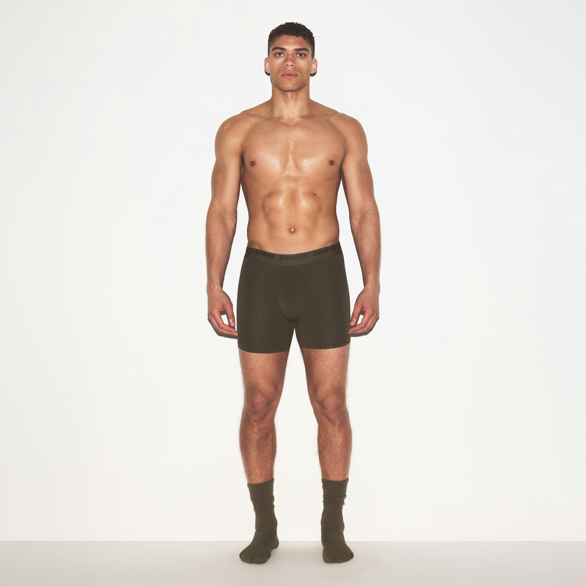 SKIMS STRETCH MENS 5" BOXER BRIEF | LODEN ON A MODEL FRONT VIEW @ | FOCUS: 0.0, 1.0, 0.9