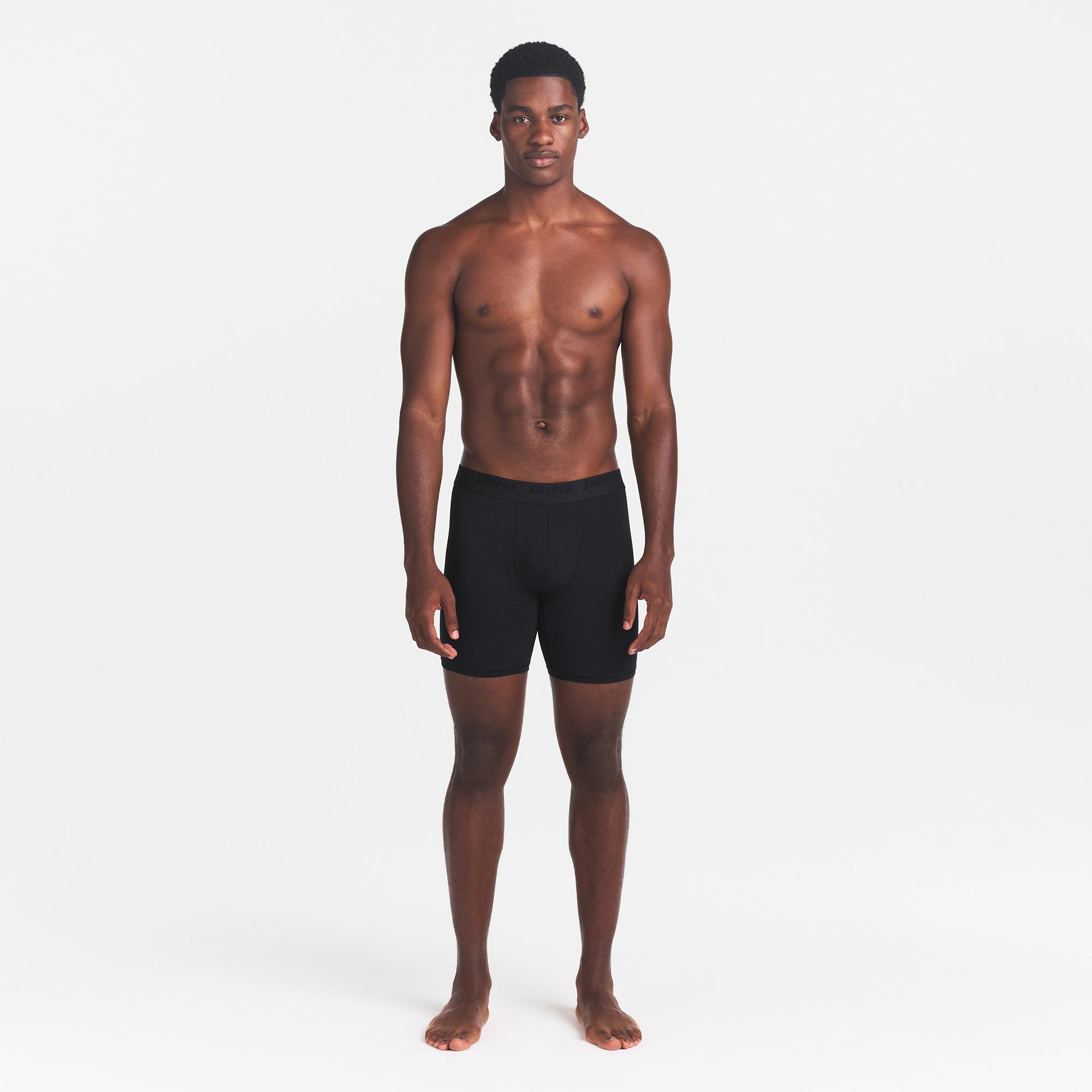SKIMS STRETCH MENS 5" BOXER BRIEF | OBSIDIAN ON A MODEL FRONT VIEW