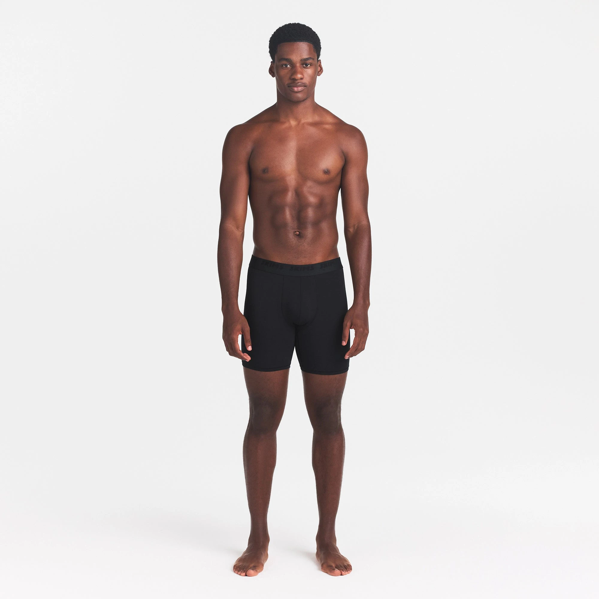 SKIMS STRETCH MENS 5" BOXER BRIEF | OBSIDIAN ON A FRONT SIDE VIEW