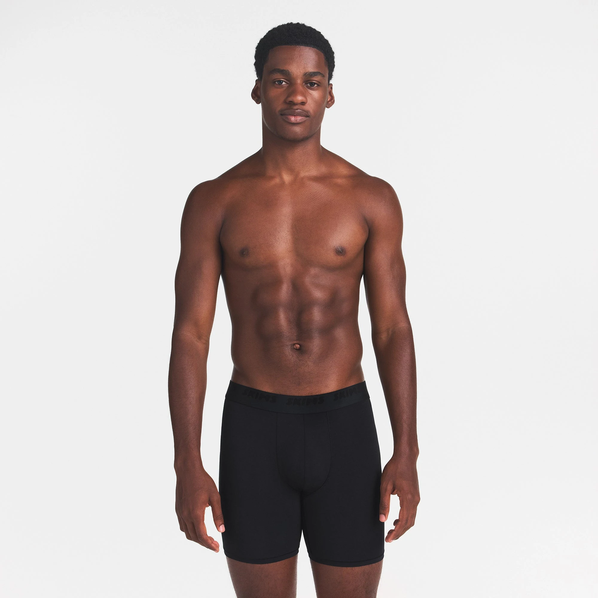 SKIMS STRETCH MENS 5" BOXER BRIEF | OBSIDIAN ON A FRONT SIDE VIEW