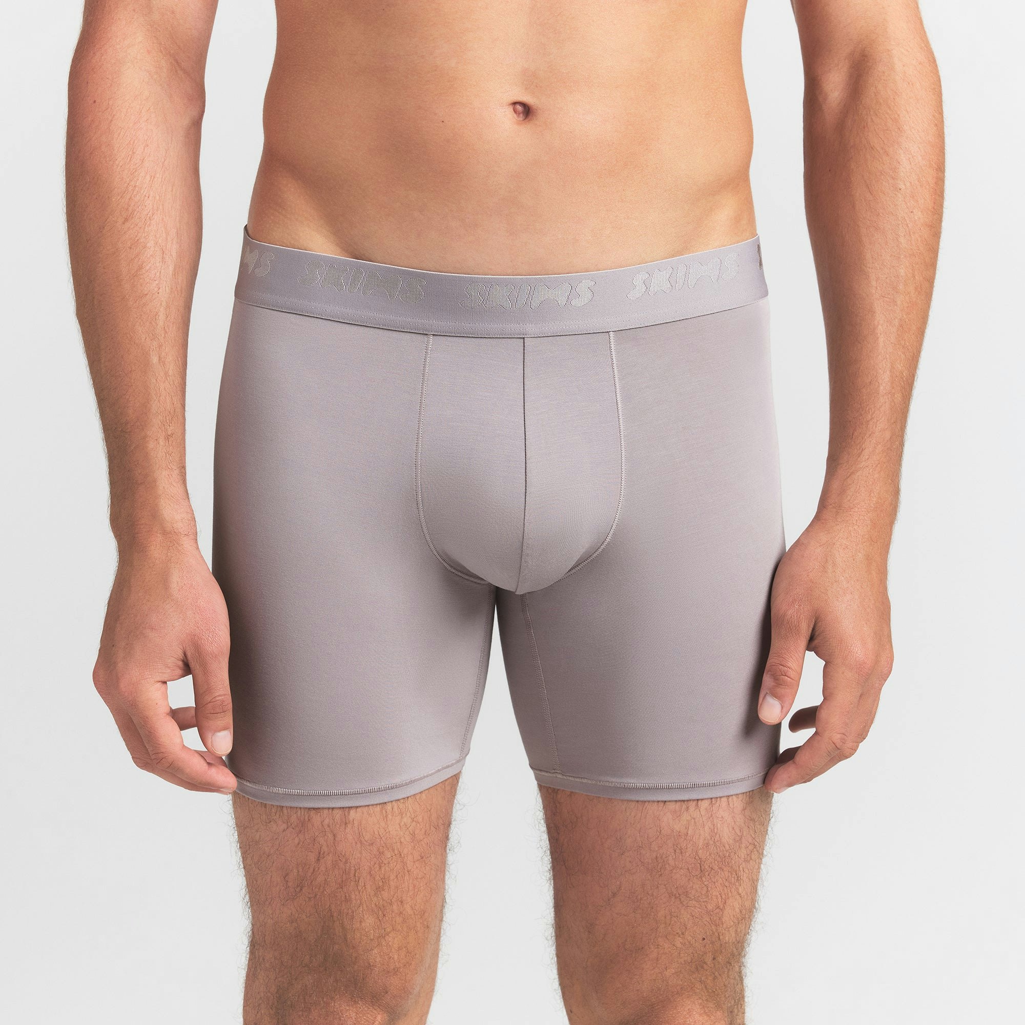 SKIMS STRETCH MENS 5" BOXER BRIEF | OYSTER ON A MODEL FRONT VIEW @ | FOCUS: 0.0, 1.0, 0.9