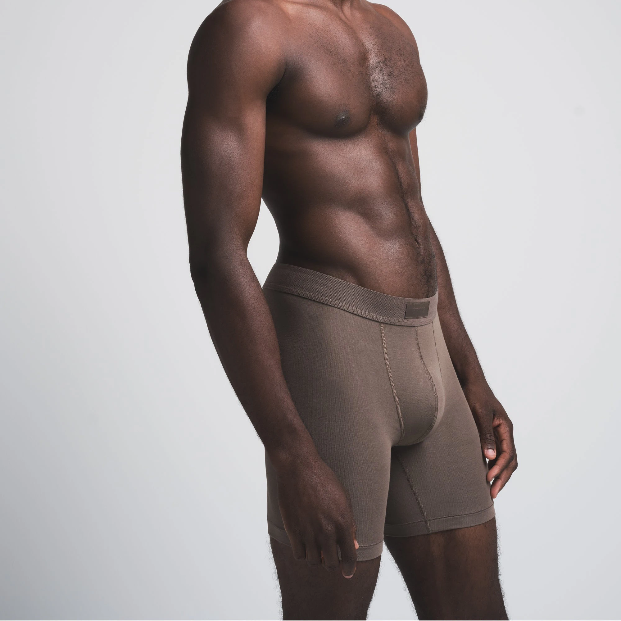 SKIMS COTTON MENS 5" BOXER BRIEF | AMETHYST (MENS BOXERS) ON A MODEL FRONT VIEW