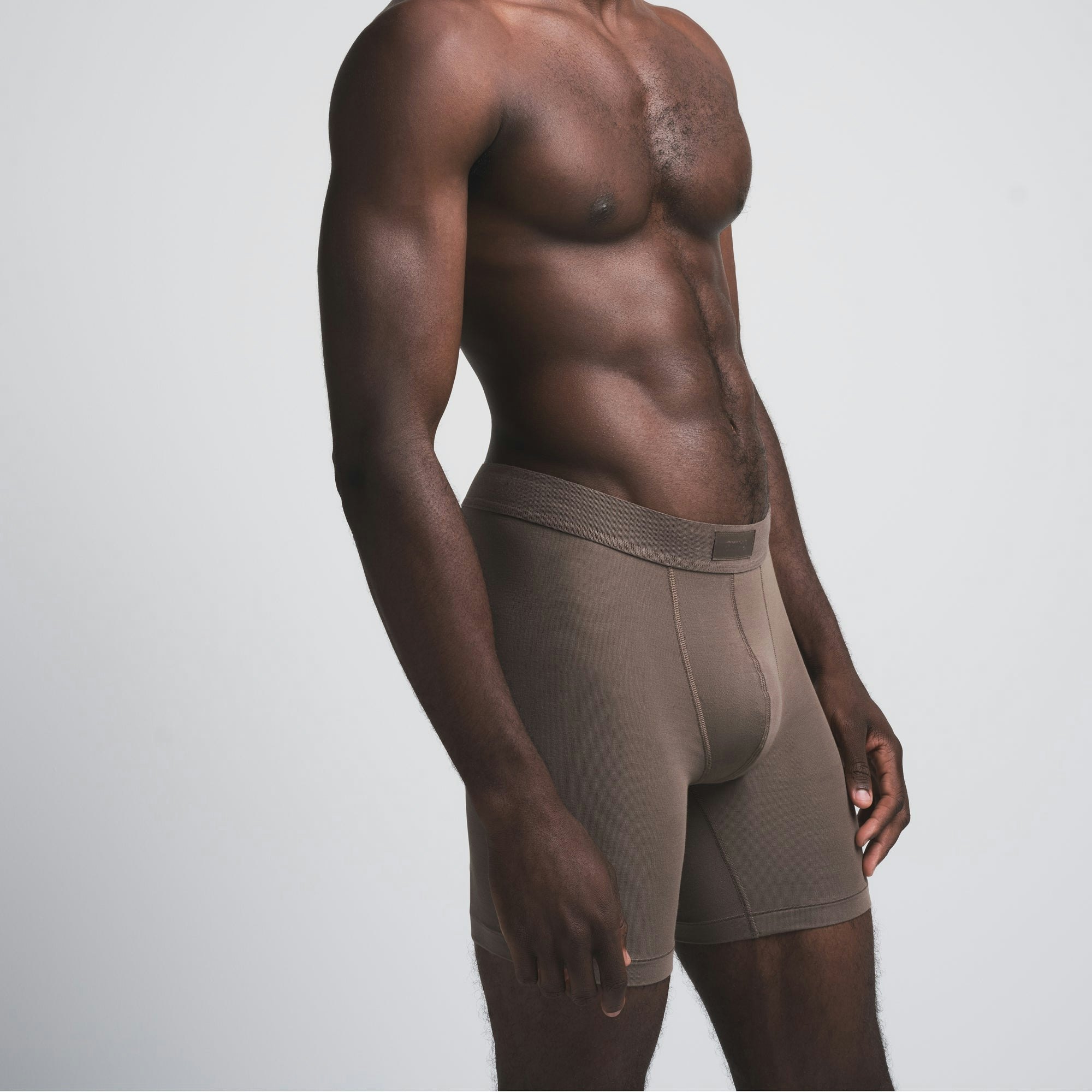 SKIMS COTTON MENS 5" BOXER BRIEF | AMETHYST (MENS BOXERS) ON A MODEL FRONT VIEW