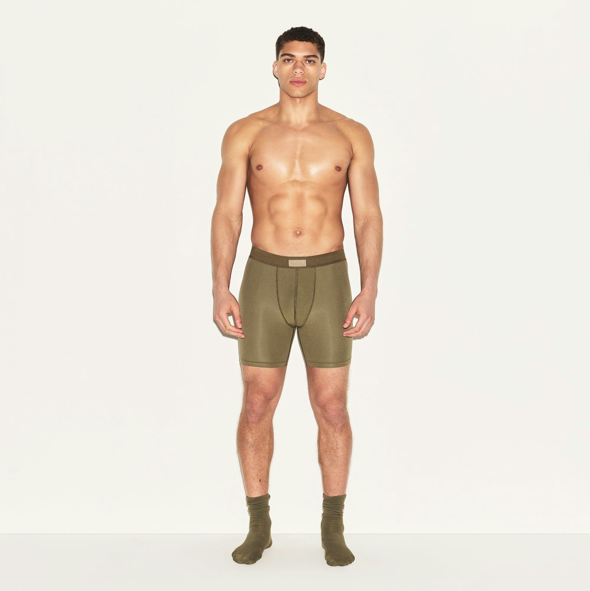 SKIMS COTTON MENS 5 INCH BOXER BRIEF | ARMY ON A MODEL FRONT VIEW | FOCUS: 0.0, 1.0, 0.9