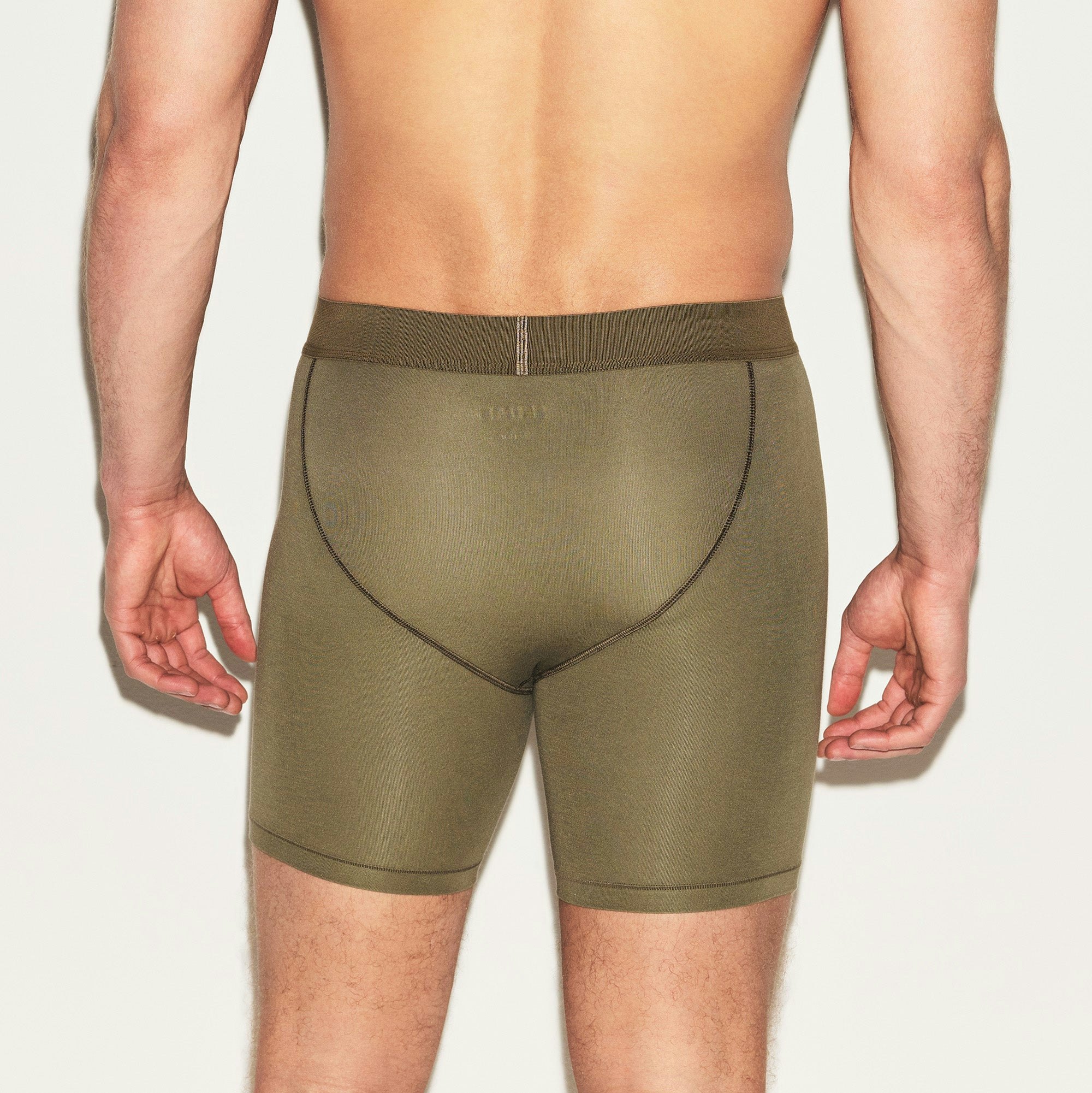 SKIMS COTTON MENS 5 INCH BOXER BRIEF | ARMY ON A MODEL BACK VIEW | FOCUS: 0.0, 1.0, 0.9