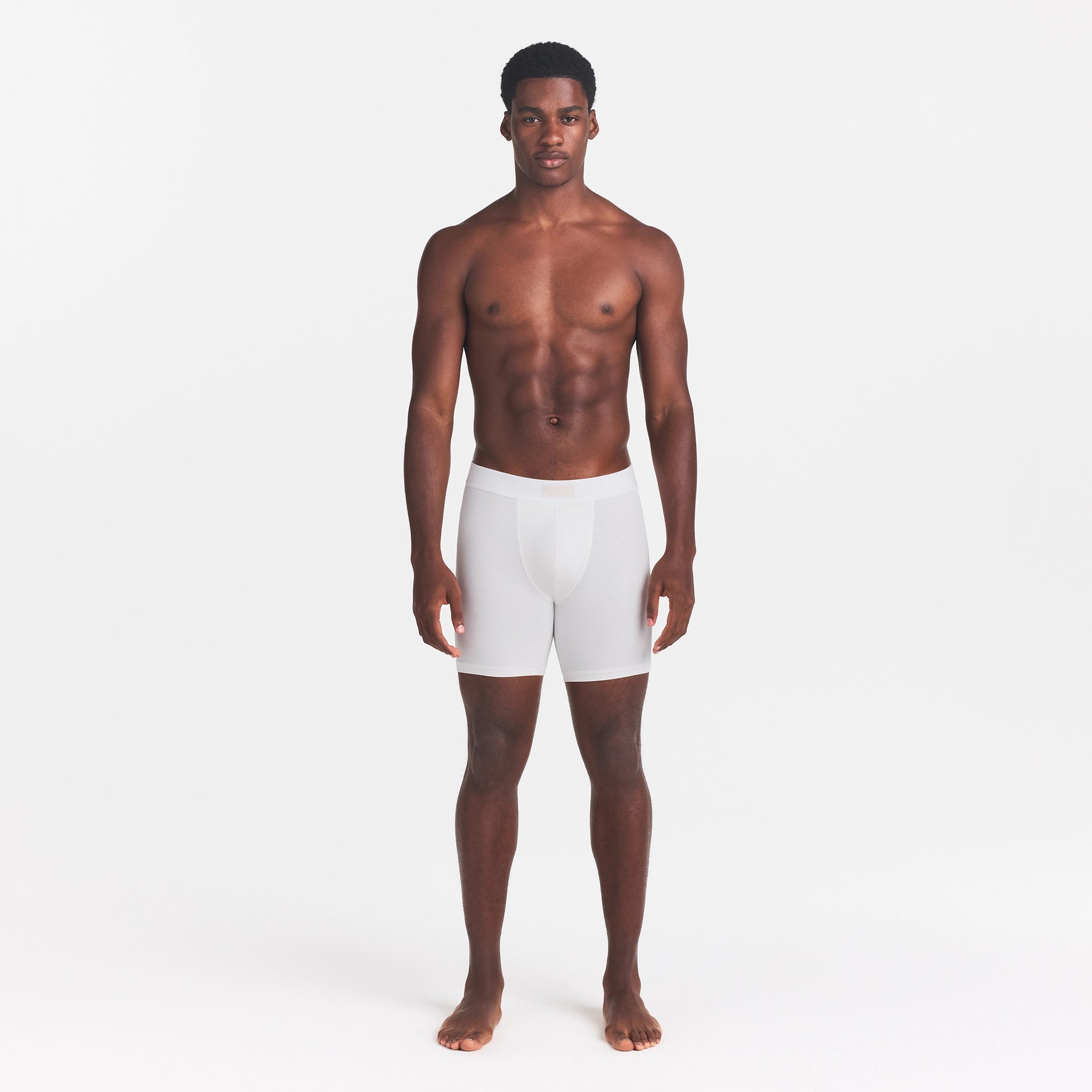 SKIMS COTTON MENS 5" BOXER BRIEF | CHALK ON A MODEL FRONT VIEW @ | FOCUS: 0.0, 1.0, 0.9