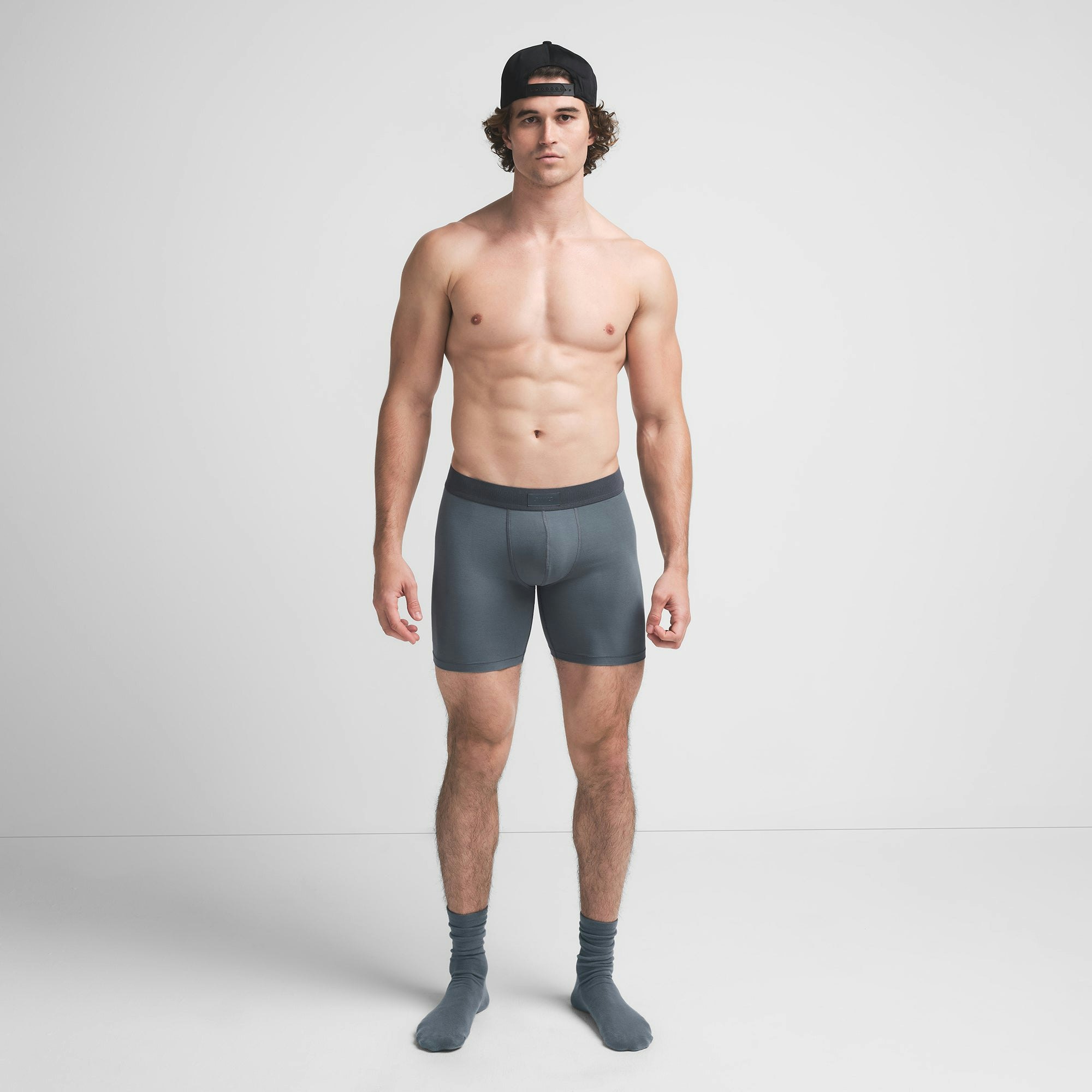 SKIMS COTTON MENS 5" BOXER BRIEF | KYANITE ON A MODEL FRONT VIEW @ | FOCUS: 0.9, 0.1, 0.7
