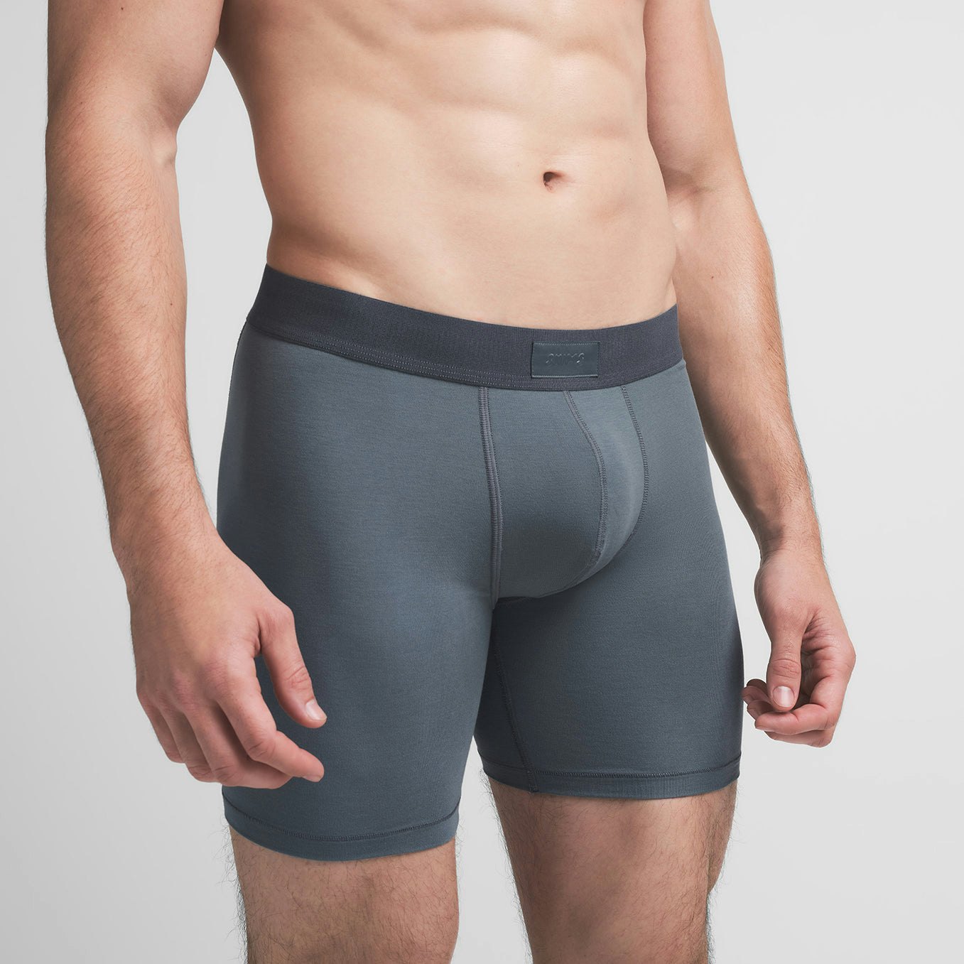 SKIMS COTTON MENS 5" BOXER BRIEF | KYANITE ON A MODEL SIDE VIEW @ | FOCUS: 0.9, 0.1, 0.7