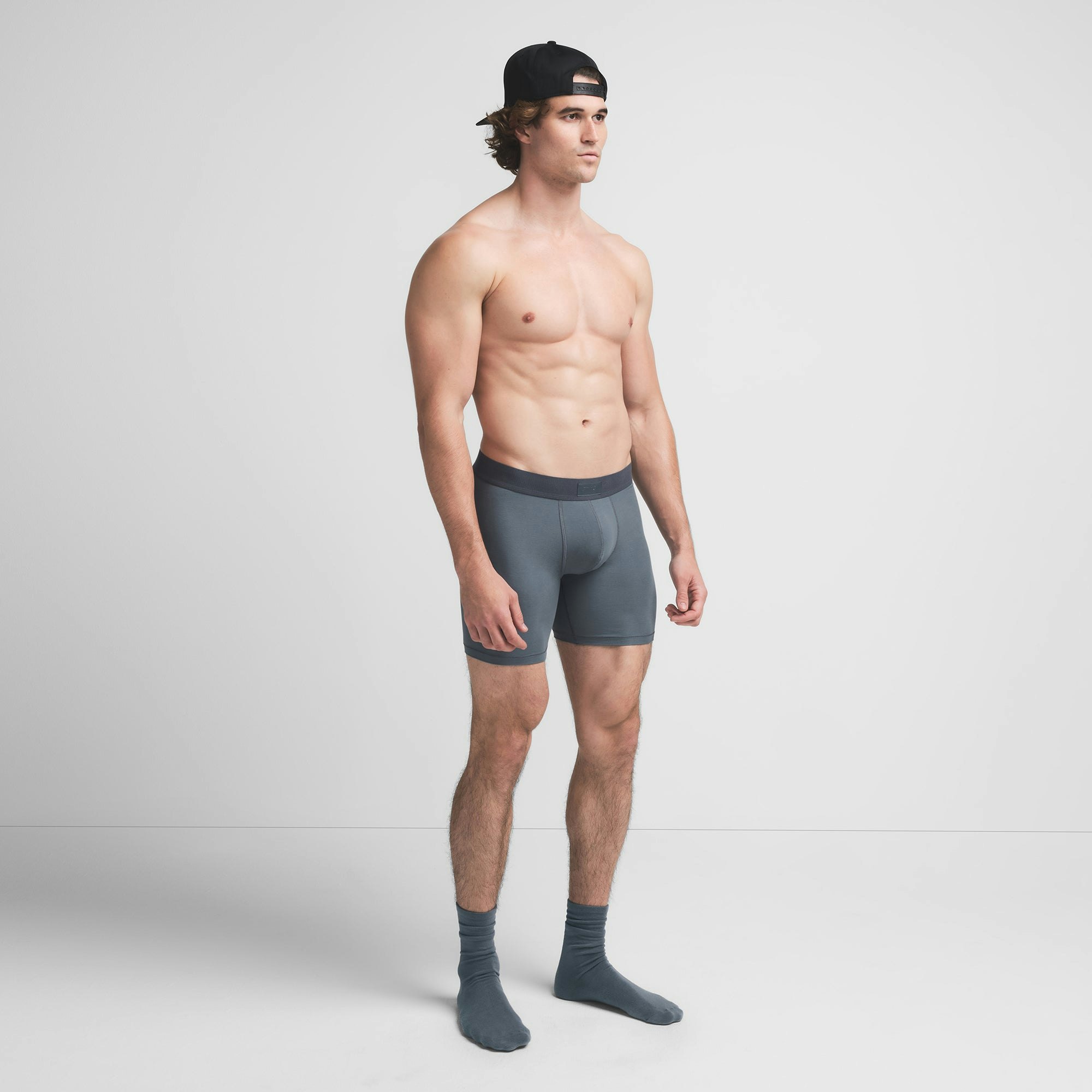 SKIMS COTTON MENS 5" BOXER BRIEF | KYANITE ON A MODEL SIDE VIEW @ | FOCUS: 0.9, 0.1, 0.7