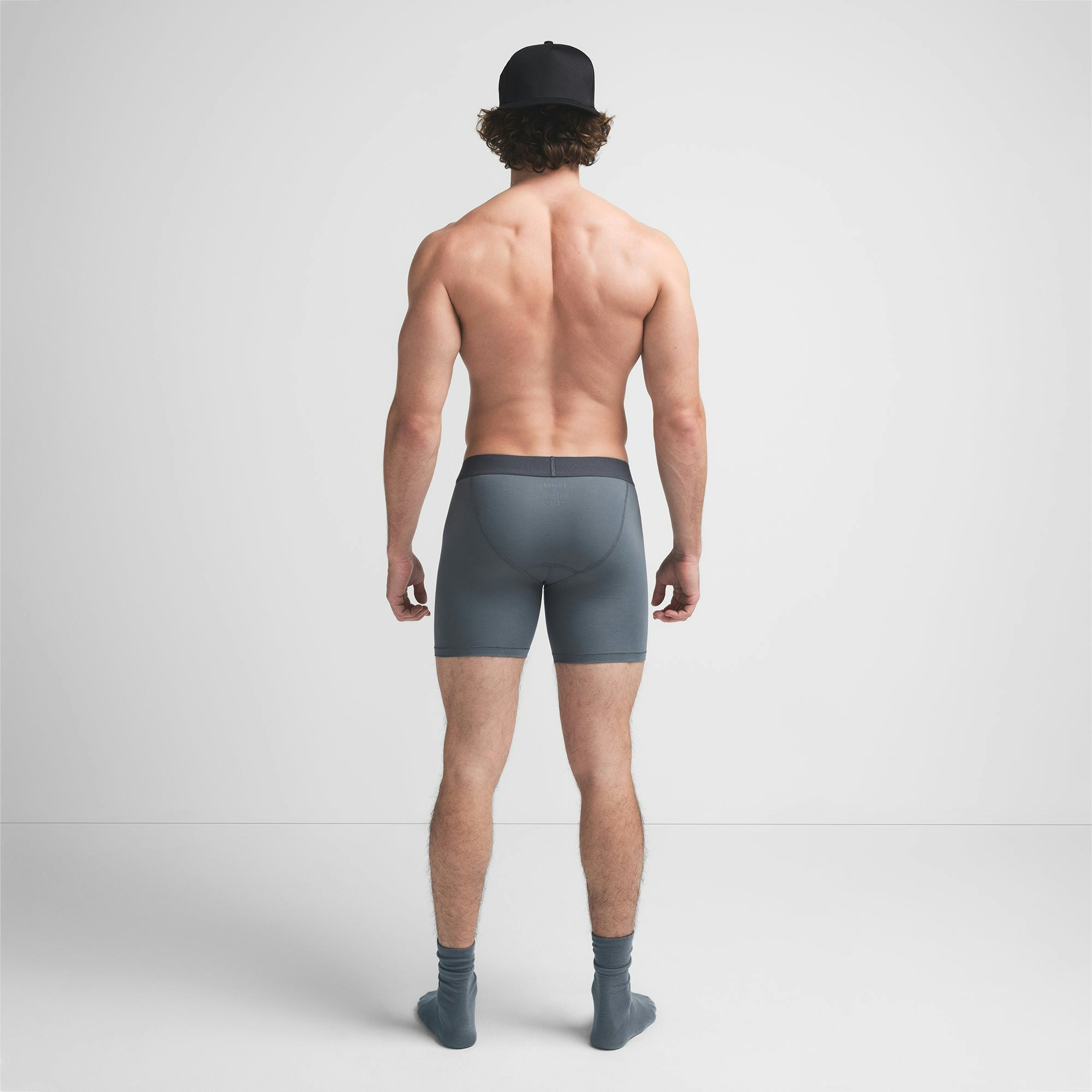 SKIMS COTTON MENS 5" BOXER BRIEF | KYANITE ON A MODEL BACK VIEW @ | FOCUS: 0.9, 0.1, 0.7