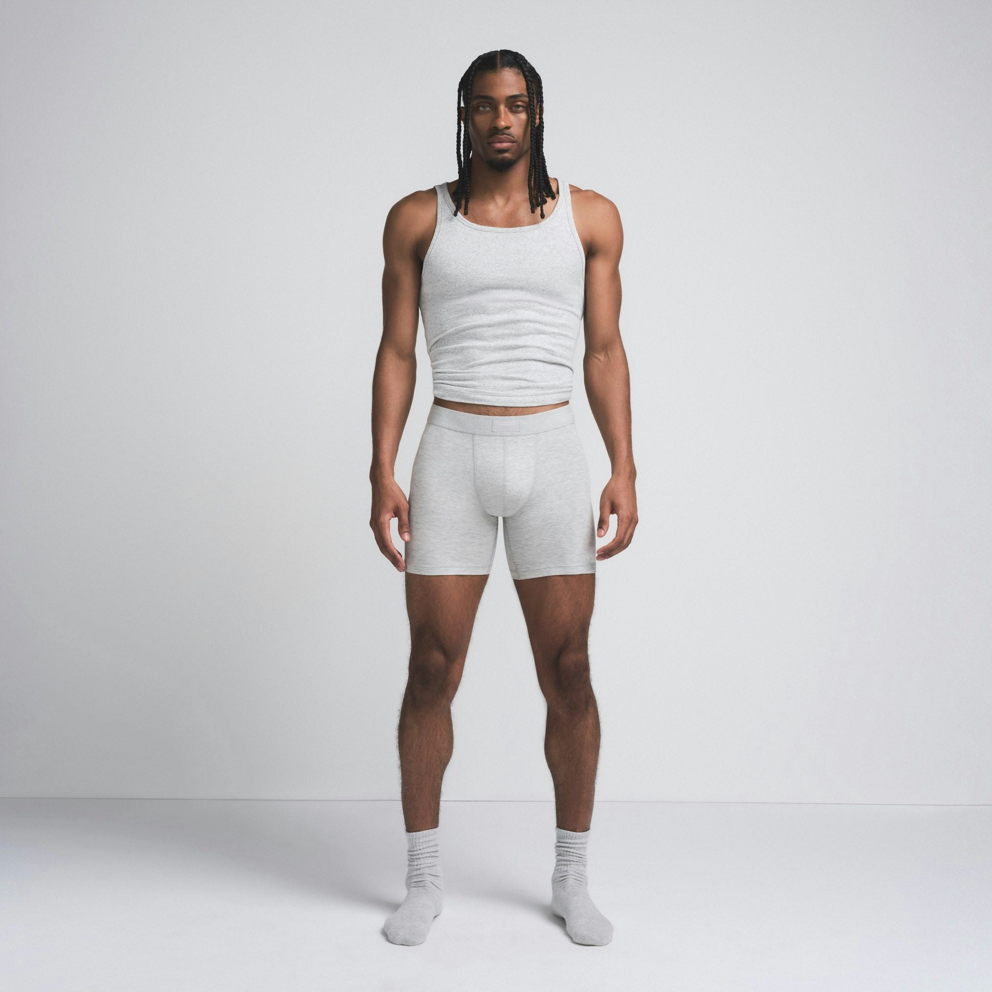 SKIMS COTTON MENS 5" BOXER BRIEF | LIGHT HEATHER GREY ON A MODEL FRONT VIEW @ | FOCUS: 0.9, 0.1, 0.7