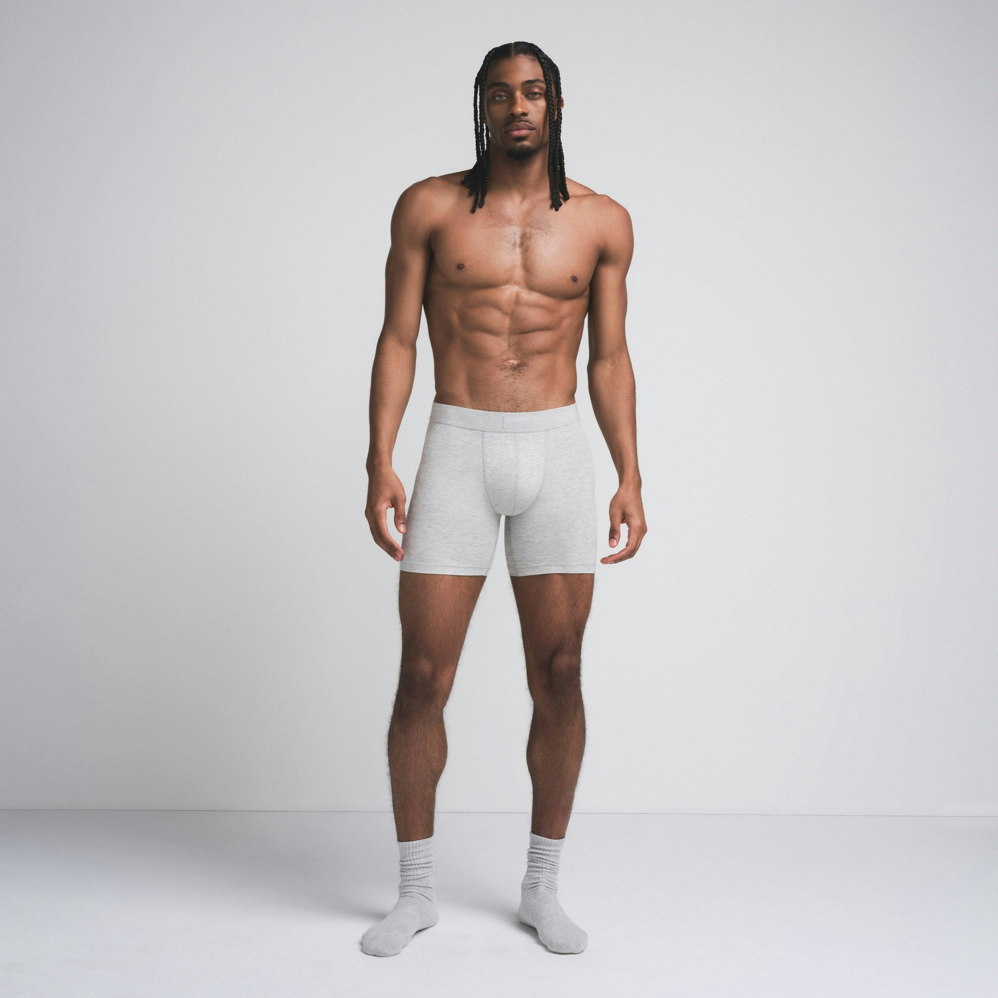 SKIMS COTTON MENS 5" BOXER BRIEF | LIGHT HEATHER GREY ON A MODEL FRONT VIEW @ | FOCUS: 0.9, 0.1, 0.7