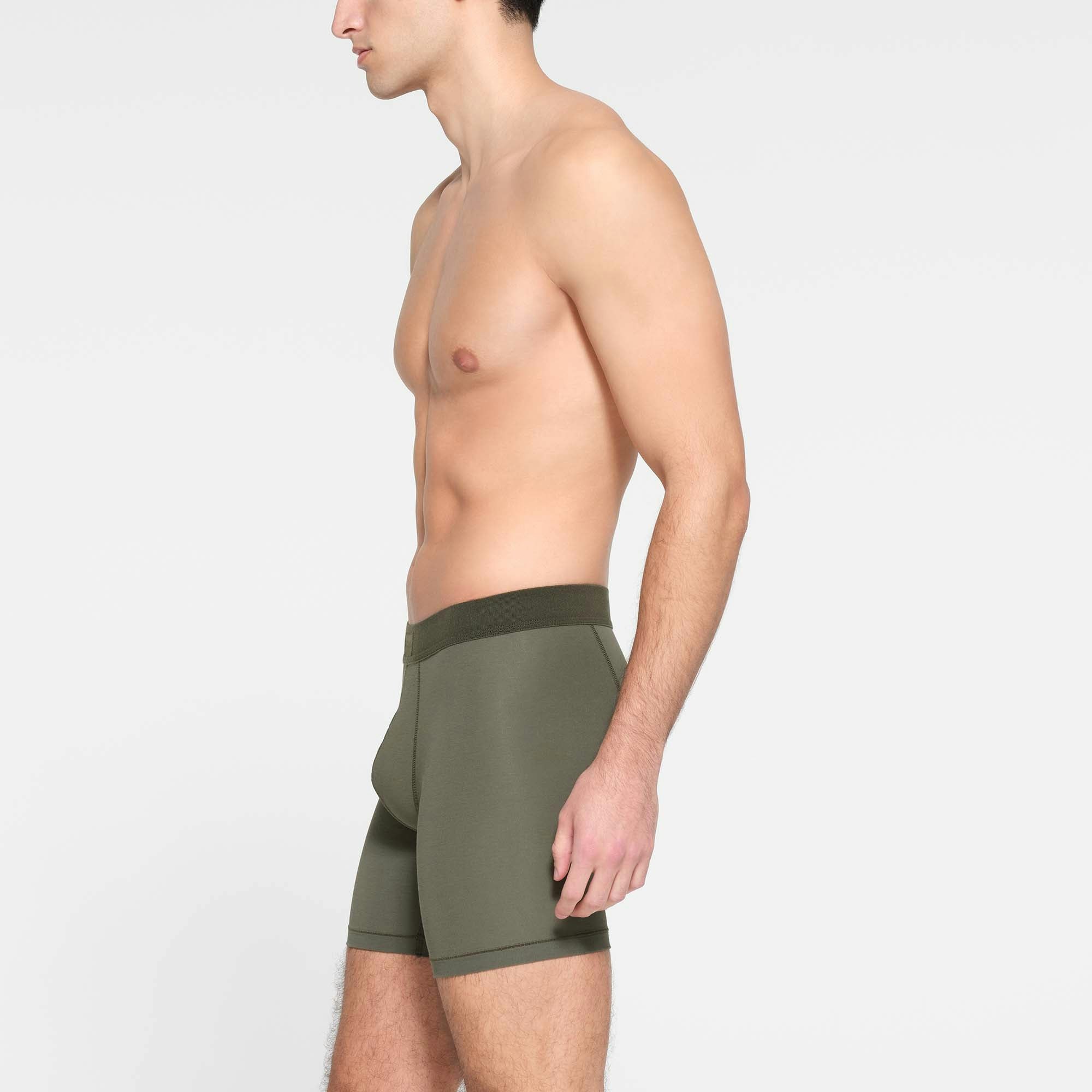 SKIMS COTTON MENS 5" BOXER BRIEF | MILITARY  ON A MODEL SIDE VIEW