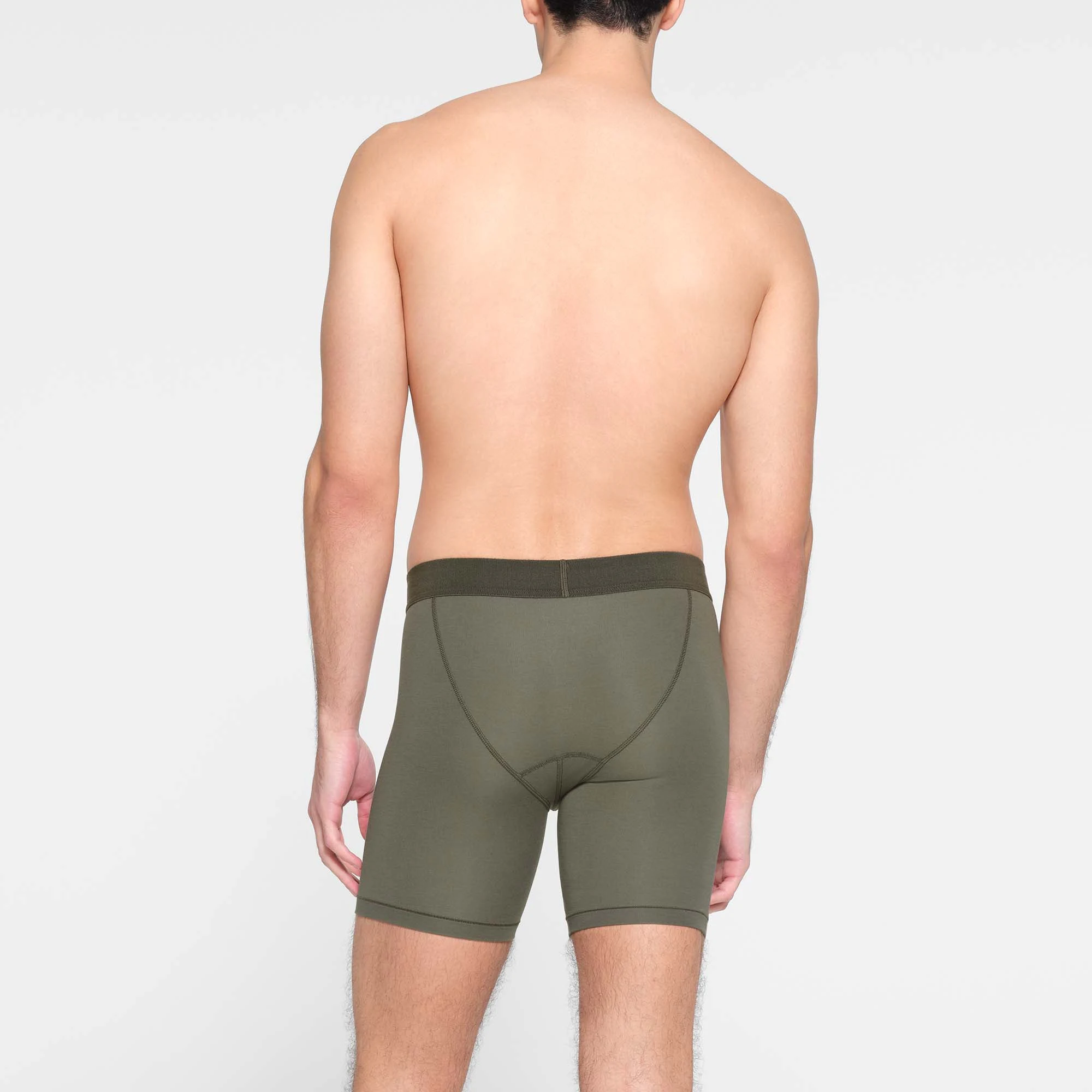 SKIMS COTTON MENS 5" BOXER BRIEF | MILITARY  ON A MODEL BACK VIEW