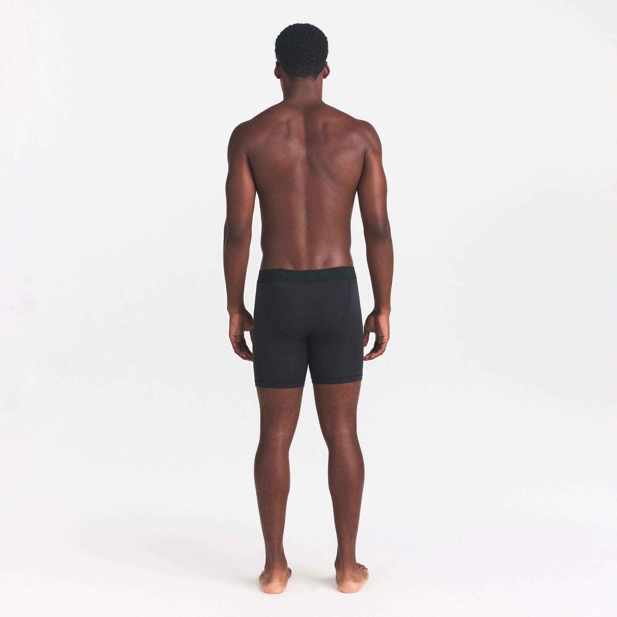 SKIMS COTTON MENS 5" BOXER BRIEF | ONYX ON A MODEL BACK VIEW