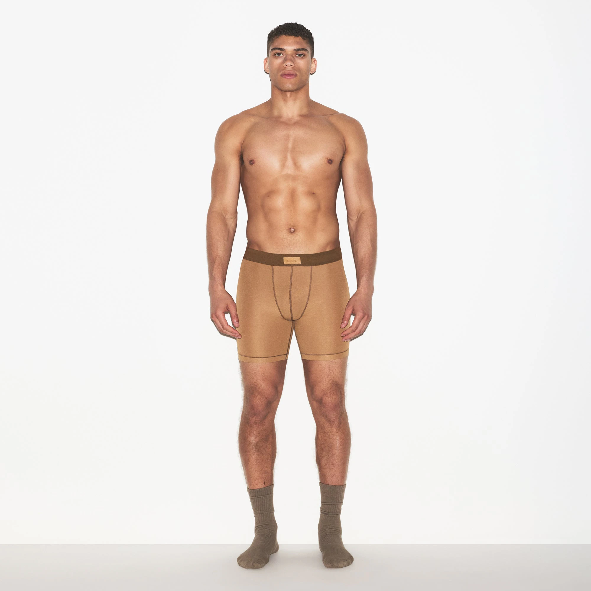 SKIMS COTTON MENS 5 INCH BOXER BRIEF | RUSSET ON A MODEL FRONT VIEW | FOCUS: 0.0, 1.0, 0.9