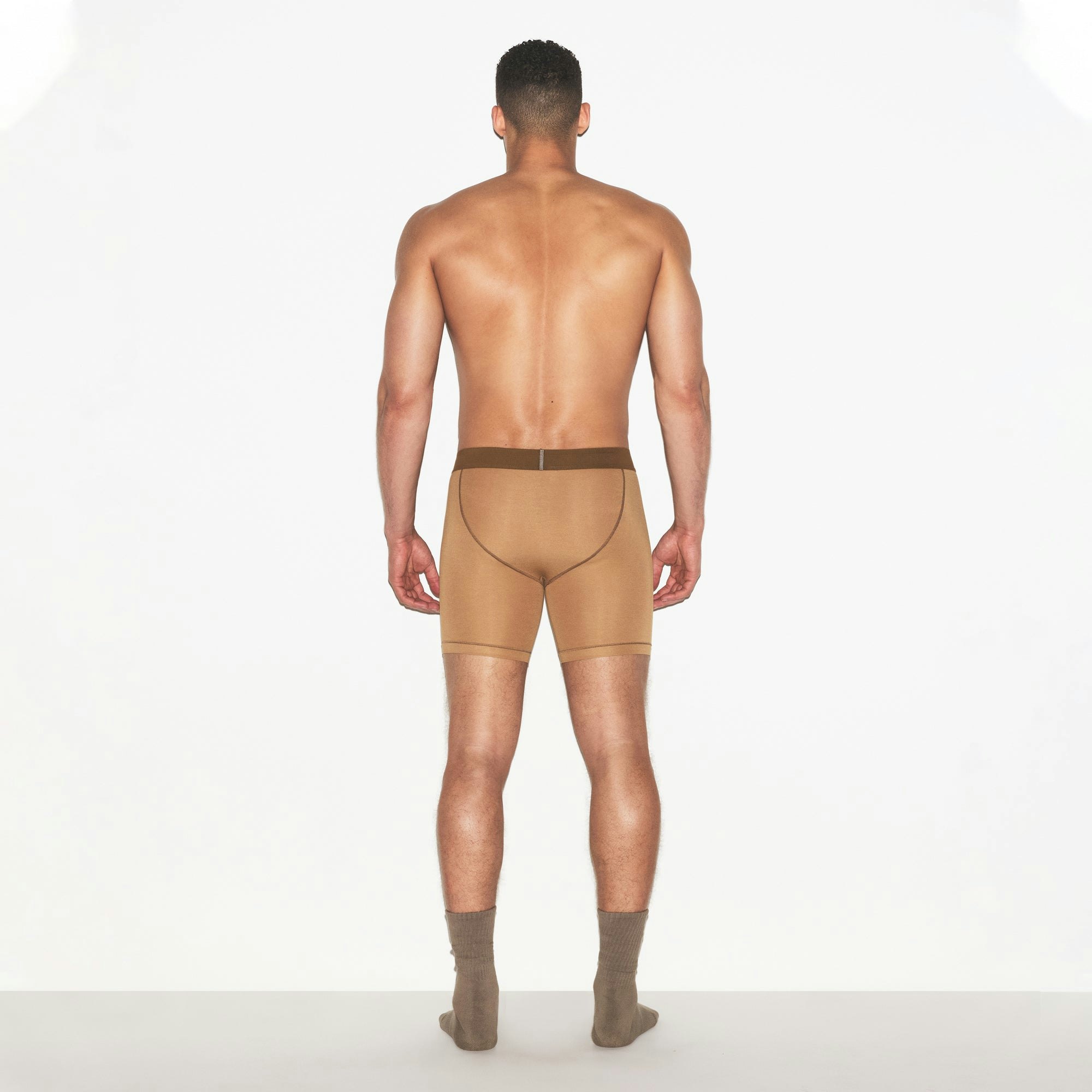 SKIMS COTTON MENS 5 INCH BOXER BRIEF | RUSSET ON A MODEL FRONT VIEW | FOCUS: 0.0, 1.0, 0.9