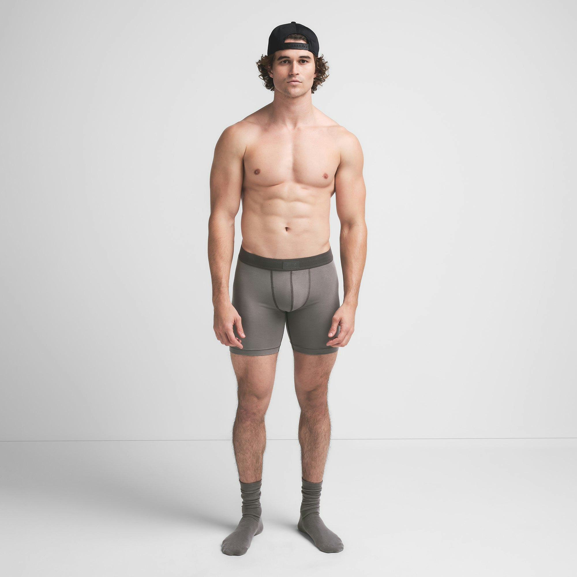 SKIMS COTTON MENS 5" BOXER BRIEF | WASHED GUNMETAL ON A MODEL FRONT VIEW @ | FOCUS: 0.9, 0.1, 0.7