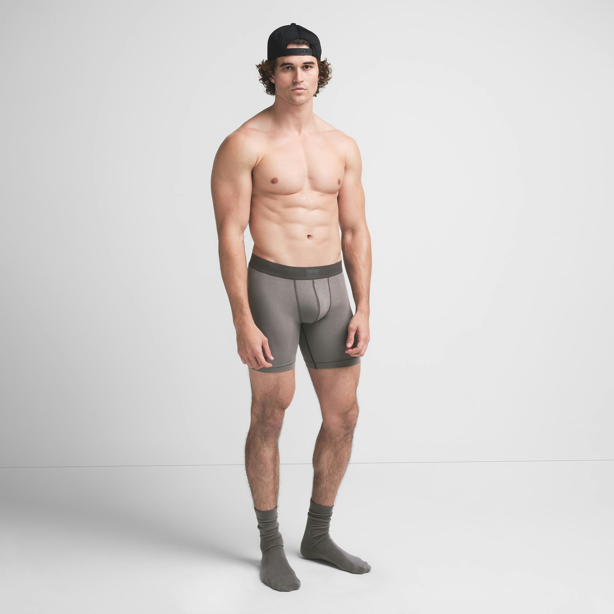 SKIMS COTTON MENS 5" BOXER BRIEF | WASHED GUNMETAL ON A MODEL SIDE VIEW @ | FOCUS: 0.9, 0.1, 0.7