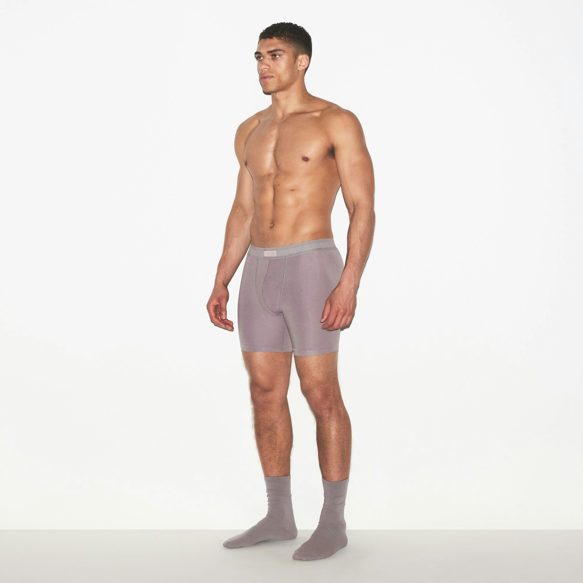SKIMS COTTON MENS 5 INCH BOXER BRIEF | ZINC ON A MODEL FRONT VIEW | FOCUS: 0.0, 1.0, 0.9