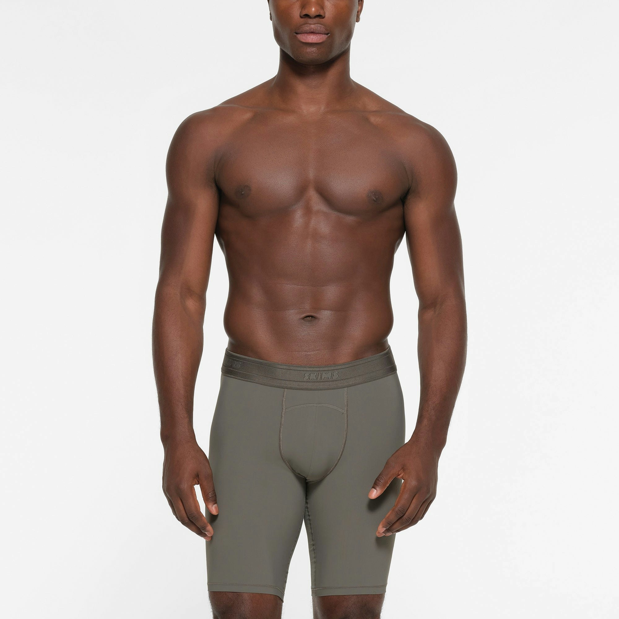 SKIMS SPORT MENS 9" BOXER BRIEF | GUNMETAL ON A MODEL FRONT VIEW