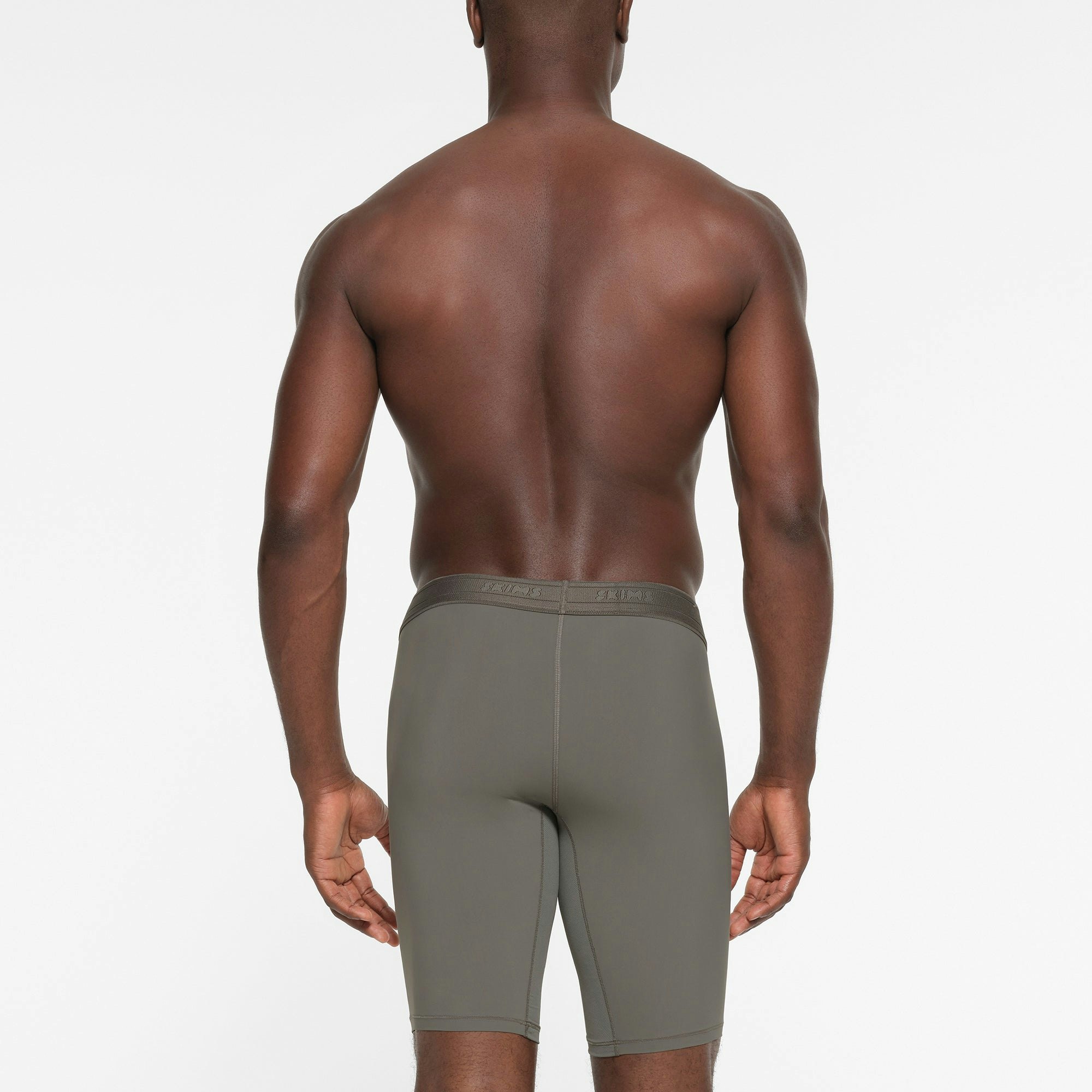 SKIMS SPORT MENS 9" BOXER BRIEF | GUNMETAL ON A MODEL BACK VIEW