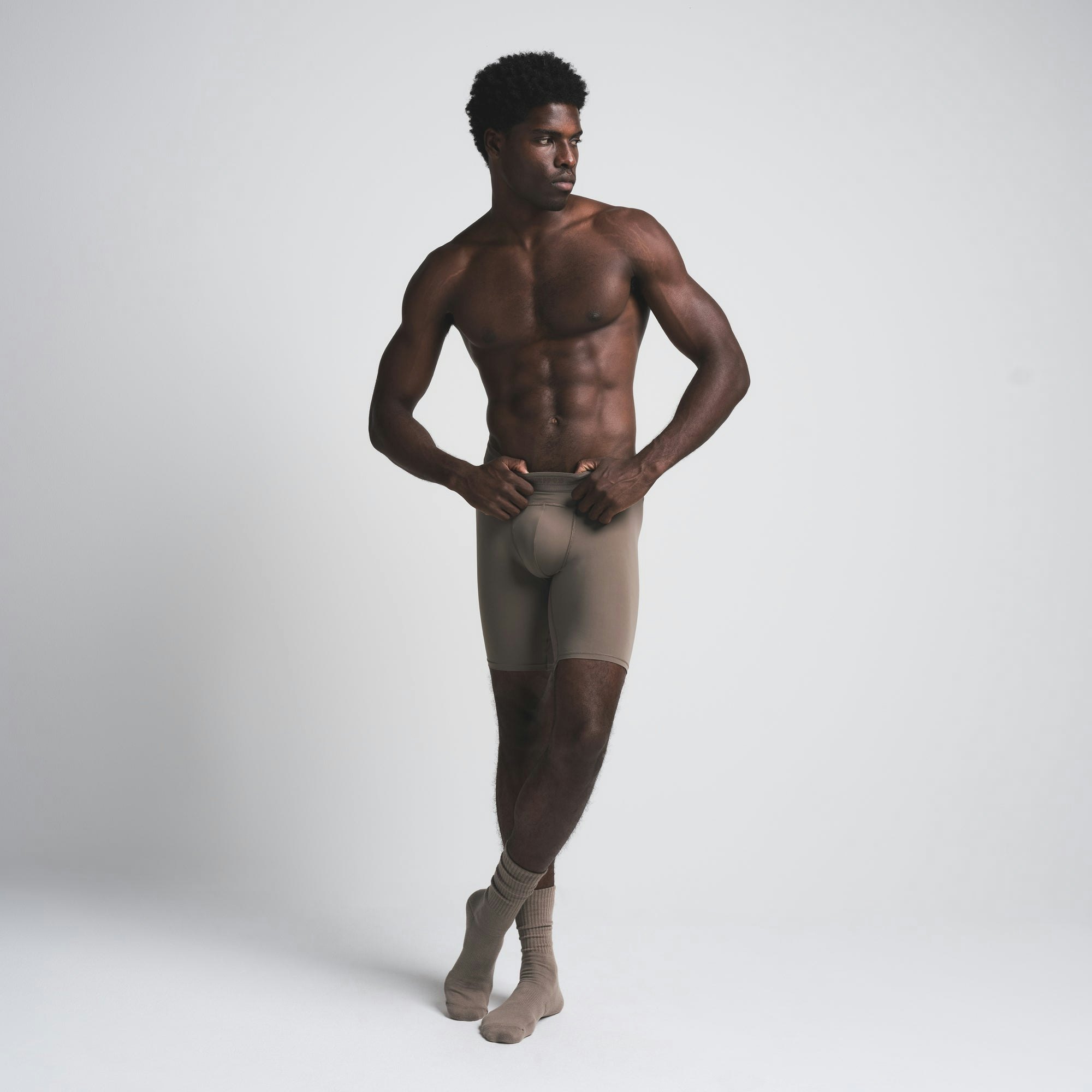 SKIMS SPORT MENS 7" BOXER BRIEF | AMETHYST ON A MODEL FRONT VIEW| FOCUS: 0.9, 0.9, 0.9